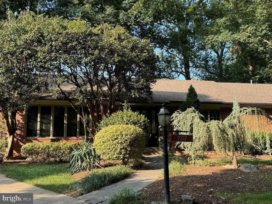 Price Reduced!!  It is a pleasure to present this this bright, spacious four bedroom, three full bath  Mid Century Contemporary Brick Rambler located in the Rollingwood Terrace subdivision of Chevy Chase. This comfortable oasis of tranquility is situated on a large, deep private lot on a quiet cul de sac. A flagstone walkway welcomes you to a marble tiled entry foyer, banquet sized dining room with hard wood floors, recessed lighting that leads to a dual office with access to a spacious screened porch. The porch overlooks a two level Koi Pond with waterfall and a free form pool with waterfall and Hot Tub enclosed in a very private fenced rear yard - perfect for outdoor entertaining. The kitchen has a kitchen island and built in kitchen table with granite countertops, high end appliances, gas cooktop, side by side refrigerator, dishwasher, built in microwave and ample cabinetry that adjoins a living room with a stone hearth fireplace. Both the kitchen and living room have recessed tray ceilings with LED lighting. The master bedroom has cathedral ceilings with a ceiling fan, bay windows overlooking the yard and pool, a wall of deep closets with built ins and organizers. The recently renovated master bathroom has a double vanity, a shower with dual shower heads and a deep soaking tub. The hall features a lighted display wall, a linen closet and a full bath. There are two light-filled additional bedrooms on the main level with large windows, ceiling fans and closets also with built ins and organizers. The lower level has an open family room with stone fireplace, a bar and pool table, ceramic tile floors and a walkout level door to the beautiful back yard. The lower level also has a large multifunction room, currently used as a gym, a storage room, laundry room and utility room an additional bedroom with a full bath. There are also two dens with the potential to become fifth and sixth bedrooms. Great location – blocks to shopping, dining, Rock Creek Park and buses to three Metro stations.  Pre offer inspections encouraged!