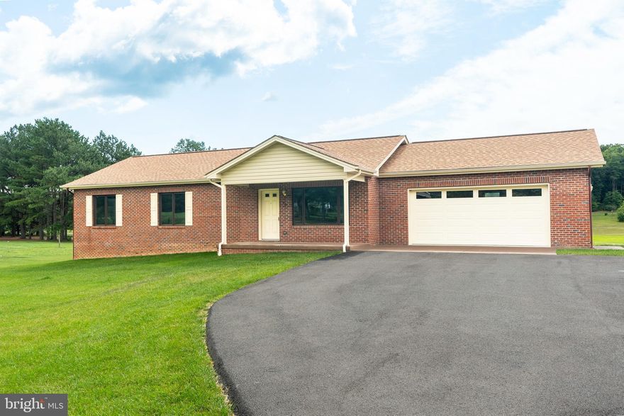 Tons of opportunity!  Beautiful home in the heart of the Shenandoah Valley.  This newer mostly brick build sits on just over 3 acres west of Woodstock.  The main floor features 3 bedrooms, 2 full bathrooms, kitchen, dining room,  living room, and screened-in porch.  The  full unfinished walk-out basement offers an abundance of potential with a laundry room and half bathroom.   Also headlining the property is an attached 2 car garage with power opener and side entry with a paved driveway.  This property truly delivers country living and convenience to town.