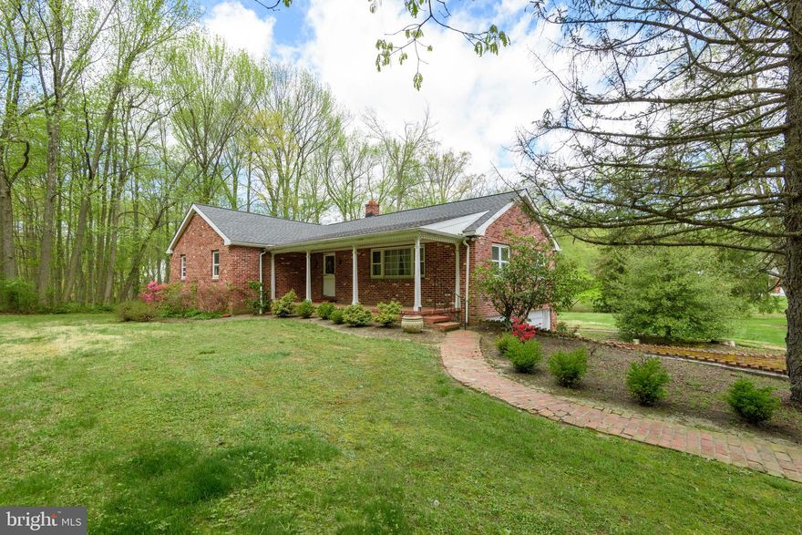 TWO PARCELS: 
A wonderful opportunity awaits with this unique property offering a home, barn, and two separate parcels with endless potential in the highly acclaimed Garnet Valley School District.
Set against a picturesque backdrop, the property backs to a peaceful stream, creating a serene and private setting. The residence is a charming brick raised ranch brimming with character and ready for your personal touch. A welcoming front porch leads into a classic center hall layout, where a spacious living room is highlighted by a triple window that fills the space with natural light. The eat-in kitchen features oak cabinetry, stainless steel appliances, and a generous pantry, flowing seamlessly into a bright rear sunroom perfect for morning coffee or casual entertaining. A formal dining room provides additional space for gatherings and everyday living. The home offers four bedrooms and two full baths, including an owner’s suite with a large walk-in closet and en-suite bath w/ shower. Partial basement, built-in two-car garage,
The adjoining parcel, included in the sale, features a two-story barn equipped with electricity and a wood stove, ideal for hobbyists, storage, or potential adaptive use. Buyers are encouraged to verify with the township regarding possibilities for new construction on this lot.
Important Information: The neighboring driveway appears to encroach on the adjoining parcel, and an electrical easement services the home to the rear (meter located on the barn). Buyer will be responsible for obtaining Use & Occupancy certification and complying with any applicable township requirements.
This versatile property presents a unique opportunity to create something truly special in a prime location bring your vision and unlock its full potential.