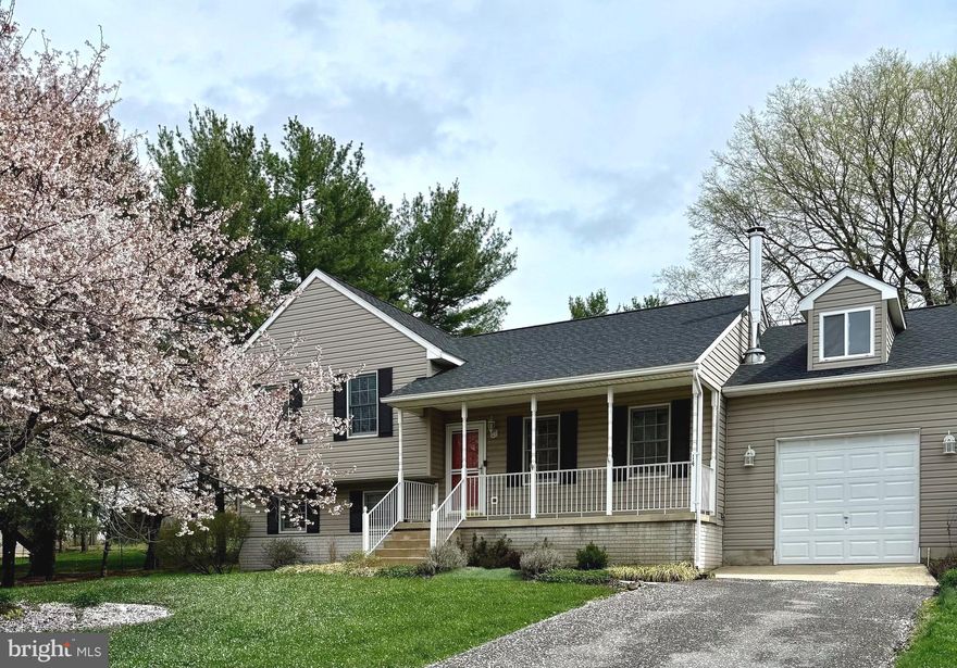 Looking for small-town charm just minutes from city conveniences? Look no further! This stunning four-level split home on the edge of historic Woodsboro is the perfect match!  This property offers peace of mind with major updates already taken care of and NO HOA! Recent updates include a newer roof, water heater, HVAC system, and more.

Nestled on a peaceful half-acre lot (approx.) at the end of a quiet, non-through street, this updated home provides a serene taste of country living. The spacious backyard offers picturesque views, and you’re just a short walk from Woodsboro Park. Plus, the property is connected to public water and public sewer for added convenience.

Step onto the charming front porch and into the entry foyer, the perfect place to hang your coat. Inside, the main level features a cozy living room with beautiful hardwood floors and an upgraded eat-in kitchen boasting granite countertops and newer appliances.

The upper level offers a relaxing retreat, complete with a primary suite, freshly painted and featuring a private bath. Two additional bedrooms and another full bath complete this level.

The lower level is an entertainer’s dream, featuring a spacious family room with a wood-burning stove and a wet bar- ideal for hosting gatherings or family game nights. A third full bath with a jetted tub adds extra convenience.

But that’s not all! The fourth level offers two versatile rooms, giving you plenty of space to make it your own-whether it’s a home office, gym, or hobby room.

Don’t miss your chance to call 14 James St. home!  Convenience is key here- located just outside Walkersville, the house is minutes away from parks, all the shopping and dining options Frederick has to offer. Plus, the convenience of nearby Route 15 and easy access to I-270 and I-70 means you can enjoy quick commutes to Washington, DC and Baltimore.   Schedule your tour today and experience the perfect blend of small-town charm and modern convenience.