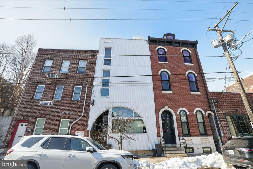 Two years of full tax abatement remaining on this exquisite unit in Kensington Yards. Double wide space with preserved original details. Enter from the spacious common staircase into a foyer with an entry closet. To the left is the great room, with soaring 10+ foot ceilings, oak floors, arched windows which bring in lots of sunlight, a full kitchen with a view of the neighboring green roof, exposed brick accent wall, and reclaimed wood peninsula. Through a restored, salvaged 19th century door, into a large bedroom with floor to ceiling window and double closet. From the foyer, access the private side deck, and the tile bathroom with large vanity, tub, and in unit washer and dryer. Additionally, there is a large common patio and garden, and in building bicycle storage. Just a few blocks to all of the Fishtown and Northern Liberties restaurants and shops, and a short walk to both the Market Frankford Line and the Broad Street Line.