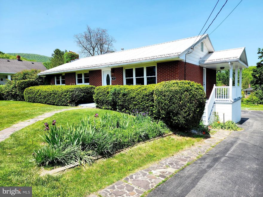 THE PRICE IS RIGHT!! NEW HOMEOWNER....COME ON DOWN! YOU'RE THE NEXT OWNER OF 77 LAVALE BLVD! Check out the improvements in this gorgeous 1 level ranch style home in LaVale! Brick exterior, metal roof, porch and patio for outdoor entertaining, new flooring throughout, fresh paint, trim, completely remodeled bathrooms with fabulous tilework, kitchen features quartz counters & stainless appliances, formal dining room with pantry behind that cool barn door and don't forget about the huge family room in the lower level with fireplace and another gorgeously remodeled full bathroom and laundry room. There is plenty of off-street parking and a 1 car built in garage that can be accessed through the back of your new home!