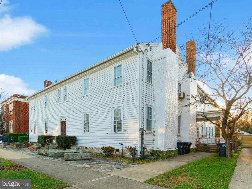 This beautiful  large Historic 1789 original Fredericksburg College & also known as the "Stoner Store"  has been converted into this beautiful 2-story 9066 sqft downtown apartment building with 7 apartments, spacious common areas and an additional 2200 sqft basement with double-door for easy access to the exterior.

You can walk into the Prince Edward Street entrance through a gorgeous antique solid-wood door, large hallway with lovely crown molding, beautiful hardwood floors with double-door back entrance that makes moving made easy. 

The upstairs houses 5 unique apartments with individual floor plans, hardwood floors, crown molding and some with fireplaces. Each apartment has separate meters for electricity and gas with shared water.

The large staircase leads you into the main level 4 beautiful sitting rooms with stunning fireplaces, a spacious common area with half bath and laundry room. At the end of the wide hallway, you will find 2 apartments with clawfoot tubs, farmhouse kitchen sink and 11 ft high ceilings. 

Below you have a large 2200 sqft unfinished basement with 11ft tall ceilings, concrete floors, and 10 large windows allowing in plenty of natural light. The basement also includes 2 half bathrooms and exterior double doors that lead into the stone moat for easy access.

This historic building has an upper level of 4533 sqft with 5 apartments, 4 fireplaces, and a wide staircase for easy moving. The main level also has 4533 sqft with 2 apartments, 4 lovely sitting rooms, a staircase, and 3 beautiful fireplaces. And then the open 2200 sqft basement has plenty of room for extra storage. All 11,266 sqft of this unique apartment building is ready for your personal touch.

The history of this 18th Century gem begins in 1789 when this Chew Family built this as their single- family home. Then it was sold to the Presbyterian church where they built a very large addition to the back of the house in 1893, and thus the home was transformed into the Fredericksburg College that could hold 250 students at one time. In 1916 the church sold the college which separated its lot from next door at 1200 Prince Edward St. that was primarily used to house the widows and orphans of the church. Eventually, the building was sold to Mr. Letcher Stoner, who converted the building into a renowned corner store. Over time the store turned into a museum that was home to 13,000 pieces of authentic Americana.