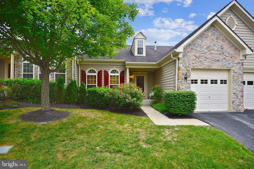 WELCOME HOME!  Hidden just off Main St in the Heart of Historic Reisterstown, your new home awaits!  Through the Gate House, this private community is what you have been searching for.  House has an impressive 3000+ sqft of living space.  Grand Entrance with Vaulted Ceilings, American Cherry Floors and Open Floor Plan.  Cozy Master Bedroom Suite strategically located for quiet and privacy.  In the Master you will find Walk In Closet, Private Bathroom with Ceramic Tile, Seated Shower and Double Vanity.  Open Kitchen with Breakfast Room Leading to maintenance free Trex Deck.  Stainless Steel GE Appliances, Bosh Dishwasher, Corian Counters and Pantry are some of the features.  Stove & Microwave were just installed!   Around the corner is the powder room and separate laundry area leading to the garage.  Just Upstairs, you will find 2 Generous size bedrooms, 2nd full bath, office/storage space and loft open to the first floor.  Enormous space downstairs.  Warm low maintenance gas fireplace in the family room.  Plenty of space for everyone!  Powder Room for convenience.  Utility Room with even more storage. Included in condo fees, swimming/lap pool, fitness center and club house.  Walking trails, gazebos and more in common areas.  One Year First American Home Warranty Included!