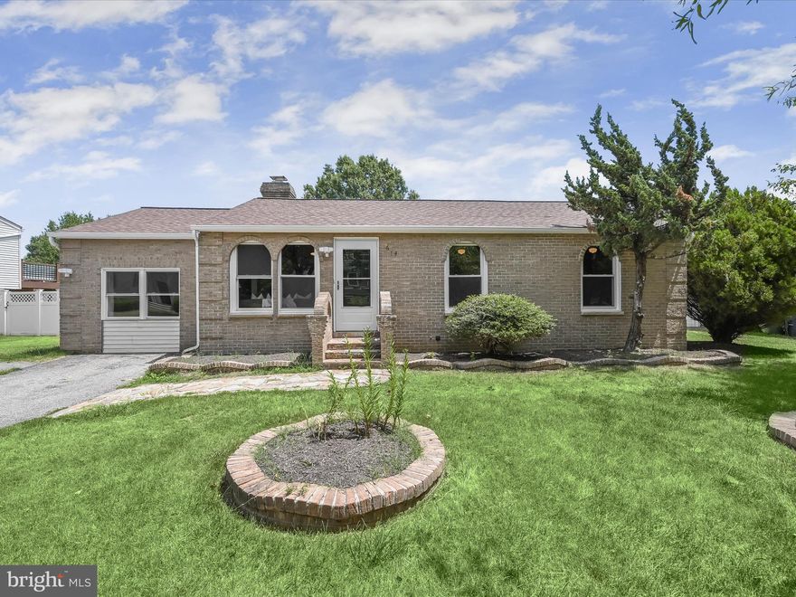 Welcome to this stunning brick and vinyl siding Spanish-inspired rancher in the  New Orchard Estates community of Upper Marlboro. The open main level features vaulted ceilings, a neutral color palette, and one of two wood-burning fireplaces with a ceramic tile surround, perfectly complementing the gorgeous hardwood floors.  The kitchen is a chef's delight, boasting stainless steel appliances, ample storage, a convenient pass-through for entertaining, and granite counters. The bright, airy dining room offers abundant natural light, access to the beautifully landscaped rear grounds, and secure storage.  Adjacent to the kitchen, the family room provides endless possibilities, highlighted by a brick accent wall and the second wood-burning fireplace with a stone surround. The primary bedroom suite is a tranquil retreat, complete with an en-suite bathroom featuring a modern vanity and a ceramic tile walk-in shower. Two additional bedrooms and an updated hall bath complete the sleeping quarters.  Conveniently located near major commuter routes including I-495, MD-200, and I-95, this home combines style, comfort, and accessibility. Don't miss the chance to make this exceptional property your own!  Updates: HVAC, HWH, roof approximately within the past 5-6 years.