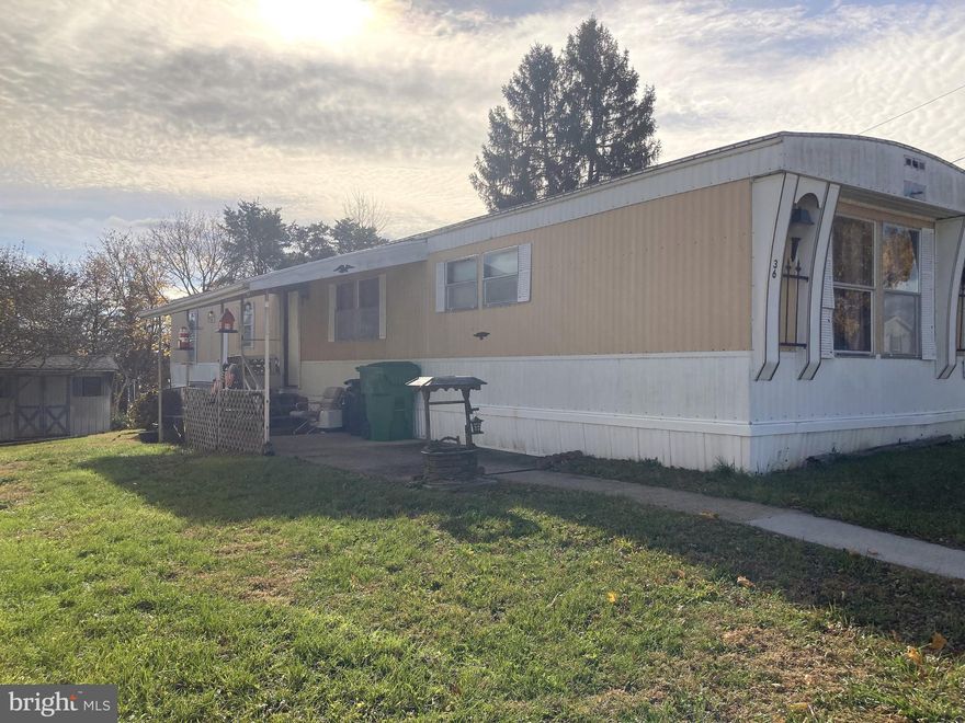 Tired of renting? Want a place where pets are welcome? Close to all Carlisle has to offer, this home offers a quiet setting with a rural feel.  Step into the foyer , remove your coat, and note the large living room with plenty of natural light. Move forward into the roomy eat in kitchen. Beyond that, is  the 1st bedroom.  On the other end of the living room, you'll find a nice laundry in the hall, 2 more bedrooms and a full bath.  Roof was replaced prior to current owner.  Some new carpet in living room  and there's a newer roof on the utility shed in the back. Enjoy the patio  in the spring and the rear yard is great for pets. Buyer must be park approved .