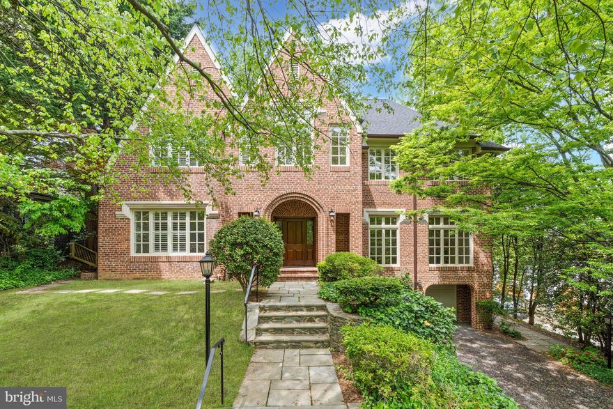 Custom built in 1988 on a large 0.27-acre lot, 4433 Cathedral Avenue presents masterful craftsmanship, refined design, and timelessly curated interiors. This brick Tudor-style home honors its historic architectural integrity while seamlessly incorporating modern upgrades and urban conveniences. Soaring 10-foot and cathedral ceilings, gleaming hardwood floors, walls of windows and numerous skylights accentuate the open-concept home’s incredible scale that extends over 4 fully finished levels. Spanning approximately 8,492 total square feet, the 7 Bedroom, 6 Full Bathroom, 1 Half Bathroom residence has been thoughtfully designed to adapt to its owner’s desires. Outside its impeccable interiors, an enchanting urban oasis awaits. Boasting a walkout rear deck and multiple hardscaped patios, waterfall pond, mature trees, lush landscaping, and pristine gardens encompass the home to provide a private sanctuary in our nation’s capital. Offering the sought-after urban convenience of a 2-Car Attached Garage and additional driveway parking spaces, this Wesley Heights residence is uniquely sited just a few blocks away from restaurants and shopping on New Mexico Avenue, as well as Batter Kemble and Glover Archbold Parks.