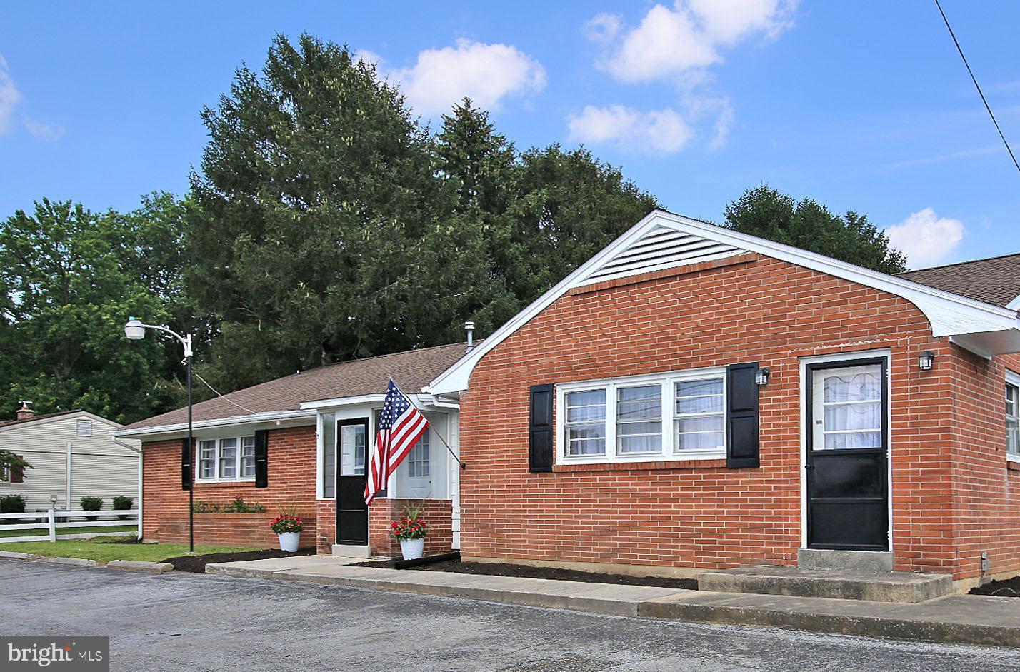 Welcome to this newly updated and spacious brick ranch home with 1.21 acres ( consisting of two tracts of land on 1 deed) located in the desirable Cornwall Lebanon School District. With over 2,000 square feet of living space this home offers a flexible layout, modern updates, and endless opportunity for its next owner. A standout feature of this home is the large bonus room with its own private entrance and half baths- ideal for an in home office/business . The built-ins add charm and practical storage while the knotty pine walls enhance the character of this room . The bright and airy living room features hardwood flooring and a wood-burning fireplace—perfect for cozy nights at home. A second bonus area comes complete with a pellet stove creating a warm, inviting atmosphere and more space for relaxing or entertaining. The generously sized bedrooms offer peaceful retreats, while the updated kitchen and bath and new paint and flooring throughout ensure that this home is truly move-in ready. Outside, you'll also appreciate the recently replaced roof, large detached two-car garage, extended asphalt driveway offering plenty of parking and access to the property via two separate public roads. Enjoy all the peace of suburban living with the convenience of nearby shopping, dining, as well as recreation with Stoever's Dam close by. Bring the entire family and see for yourself why this home could be the perfect fit and the one you've been looking for. The possibilities are endless . (Buyer to verify any visions or ideas for the property and or parcels with the zoning office)