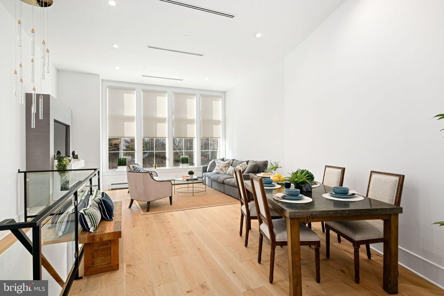 Welcome to 257 Lyceum Avenue, a meticulously designed new construction home by premier local builder Main Street Development and award winning architect Morrissey Design. This 3-bedroom, 3.5-bathroom luxury residence seamlessly blends modern elegance with everyday convenience, all within walking distance of Manayunk’s vibrant Main Street. Thoughtfully designed with standout features, this home boasts heated sidewalks and driveway, garage parking with an EV outlet, and large fenced backyard. Inside, enjoy 7-zone heating and cooling for personalized comfort, along with heated floors in all bathrooms, custom window treatments throughout, and a central vacuum system. Upon entry, you’ll find a one-car garage with EV outlet, extra room for storage, and a welcoming foyer. Ascend to the expansive main living level, where soaring ceilings and a dramatic wall of glass flood the space with natural light. A sleek gas fireplace adds warmth and sophistication, while a convenient powder room and coat closet enhance functionality. The gourmet kitchen is a chef’s dream, equipped with matte white GE Café appliances, including a 36” French door refrigerator, 30” double oven with hood, microwave drawer, and double-drawer dishwasher. Custom modern cabinetry offers ample storage with a large pull-out pantry, complemented by white quartz countertops and a stylish herringbone tile backsplash. The second level features two generously sized guest suites. The front bedroom is bathed in natural light with a wall of windows, a walk-in closet, and an en-suite bath featuring heated flooring, a walk-in shower with a frameless glass door, and a sleek linear drain. The rear guest suite offers its own en-suite bath with a soaking tub and heated floors for added comfort. A dedicated laundry area on this floor includes a stacked washer/dryer, custom cabinetry, and counter space for added convenience. The top floor is dedicated to the ultimate primary suite retreat, designed to evoke a luxury hotel experience. The expansive bedroom opens to a step-out deck with 12x12 pedestal tiles, perfect for enjoying morning coffee or evening relaxation. A massive walk-in closet provides abundant storage, while the spa-like en-suite bath showcases a dual-head oversized step-in shower, custom double vanity, LED-lit mirror, and heated floors for the ultimate indulgence. A wet bar with a GE Café beverage center adds a touch of convenience before stepping outside through French glass doors to a large fenced-in backyard—a rare find in the city, perfect for entertaining, pets, or simply unwinding in your private outdoor oasis. 
Located with easy access to Center City, major highways, and public transportation, this home offers convenience without compromise. Plus, take advantage of the FULL 10-year tax abatement, an increasingly rare benefit that makes this home an even more attractive investment.