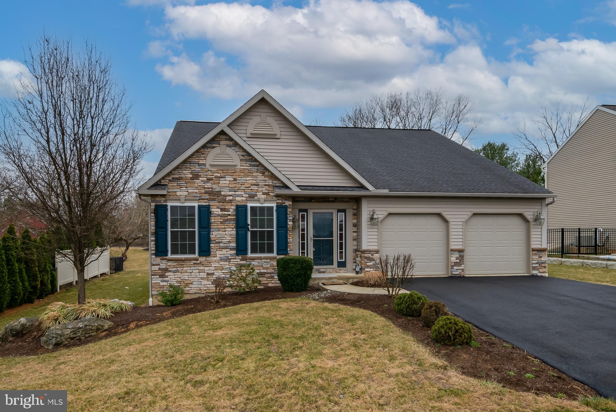 This former model home for the River Crest community is now available to you immediately. Most model homes have all the amenities people want and this one certainly fits that mold. You have 3 bedrooms and 2 full bathrooms with attractive tile flooring from the front door back to the dining room area and beyond that the flooring is Brazilian Hardwood Cherry. You have a large accent style two tiered island in this spacious kitchen with granite countertops and attractive cabinetry and complimentary backsplash. With the stainless appliances and gas stove there's a classy look to this kitchen accented by the attractive pendant lighting. There's even a tray ceiling in the dining room area and all walls have the comfortable curved bull nosed edges. The vaulted ceiling with two skylights in the family room really give a spacious and open feeling to this home. Like to spend some time on the Trex style deck? That's only a few steps away using the sliding door from the family room! Want some private time at a fireplace watching TV? You can do that to in this family room using the gas operated fireplace and the TV space above it. Though this is a 3 bedroom home you could use it as a 2 bedroom home with an office in the front room. Use it as a 3 bedroom home with the Primary suite having a cathedral ceiling, large walk-in closet and a large bathroom with double vanity and an all tile walk-in shower with two bench seats. If you'd like to have a movie theatre, music area, large bar area or some sort of recreation space the open poured concrete basement area is the place for you! Finish it off however you'd like to meet your desires...It's that large you could have 2-3 recreation space and still have room left over! Come take a look at this ready to live in home!