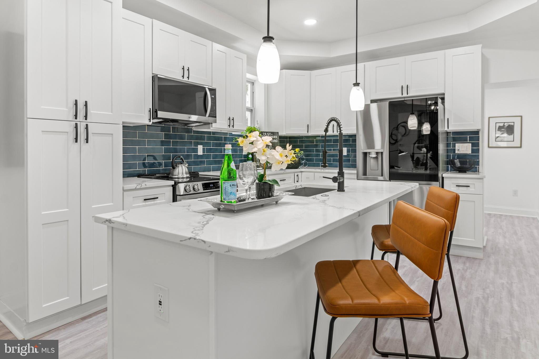 Welcome to 712 East 43rd Street – Where Historic Charm Meets Modern Elegance! This stunning 5-bedroom, 3.5-bathroom home has been meticulously renovated to blend timeless charm with contemporary style. Situated on a picturesque, pride-of-ownership street in the heart of Baltimore, this home offers the ideal combination of space, comfort, and location. Step inside to discover an expansive open floor plan adorned with soaring ceilings, abundant natural light, and premium finishes throughout. The chef-inspired kitchen is a true centerpiece—complete with smart, energy-efficient appliances, sleek cabinetry, and generous counter space, making it perfect for entertaining or everyday living. Upstairs, you'll find spacious bedrooms and spa-like bathrooms designed for relaxation. Additional features include off-street parking and a walkable location to the community pool. Centrally located near Baltimore’s renowned university corridor, this home is just minutes from Johns Hopkins University, Loyola University Maryland, Morgan State University, Notre Dame of Maryland University, Towson University, and Goucher College. Enjoy easy access to top shopping and entertainment destinations such as the Shops at Kenilworth, Dulaney Plaza, Towson Town Center, Fells Point, the Inner Harbor, and more. Outdoor enthusiasts will appreciate nearby Stony Run Park, Lake Montebello, and the Mt. Pleasant Golf Course and Ice Rink. Whether this is your personal home or savvy investment, this hidden gem offers the perfect blend of location, lifestyle, and value. Don’t miss out—schedule your private tour today!