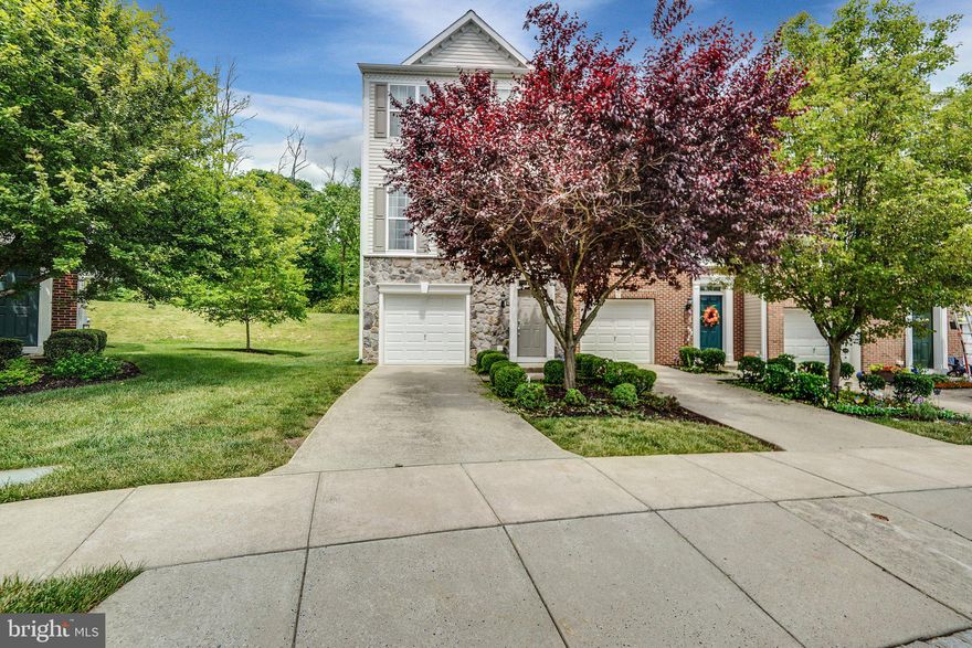 Walking into this gorgeous, light filled house, you immediately see the care and pride the owner has taken with this home. The upgraded trim on the all three levels along with the crown molding in the master bedroom make this a unique and beautiful home. Hardwood floors through part of the main level and throughout the third level are a stunning upgrade. The cook's eat in kitchen has upgraded cabinets and corian countertops with space for a large table and an extra bump out that can be used as a beautiful sitting nook or a cozy place to have your morning coffee.  Through the sliding glass door, you could enjoy endless hours of relaxation in your quiet oasis that backs to woods if you choose to install a custom deck.  The master bedroom is well appointed with it's attached master bath. The master bath has beautiful plantation shutters along with a large soaking tub and double sinks. The two remaining bedrooms are very large in size which shares the second large full bathroom. The lower walk out level is another area of luxurious living with a spacious family room, separate office and rough-in plumbing which is just waiting for your personal touch. The washer and dryer are housed in their own area and convey with the home.  This conveniently located property is peacefully secluded, and offers true perfection inside and out.
