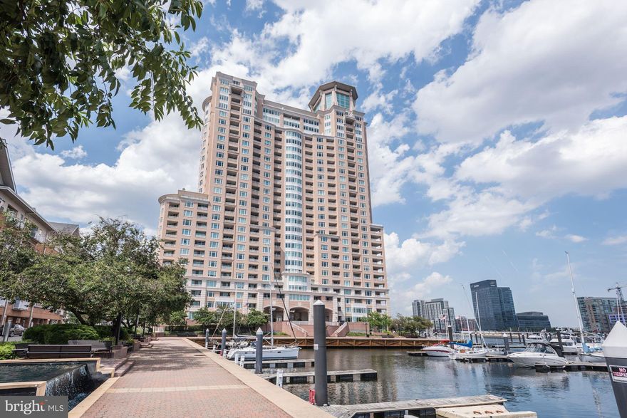 Unit 1709 - a sophisticated 17th floor condominium features approximately 1,138 square feet of living space enhanced by spectacular views of the Baltimore Inner Harbor. This home offers an open floor plan with a spacious living/dining room combo, a private one bedroom ensuite, and a separate powder room. The primary bedroom is spacious and well-appointed with extensive, mirrored built-ins for added storage and convenience. Two gated garage parking spaces convey.
The living/dining room combo affords great entertaining and daily living with beautiful custom built-ins and easy access to the private outdoor deck. A sun-drenched unit boasts large windows throughout the home that highlight spectacular views of the Domino Sugars sign, the cruise ship terminal, the outer harbor and the
build site for the Key Bridge.
Building amenities offer a gym with ellipticals, treadmills and free weights, an indoor pool, outdoor pool, party rooms with billiards and a cozy fireplace, as well as a 24/7 front desk - adding to the luxurious lifestyle the residents enjoy.
Close proximity to major arteries - I-95, I-83, and to BWI Airport and AMTRAK stations makes for easy commuting. And The Harborview Towers - located on the Inner Harbor Promenade - afford access to restaurants, shopping, and events as well as Ravens Stadium and Oriole Park.