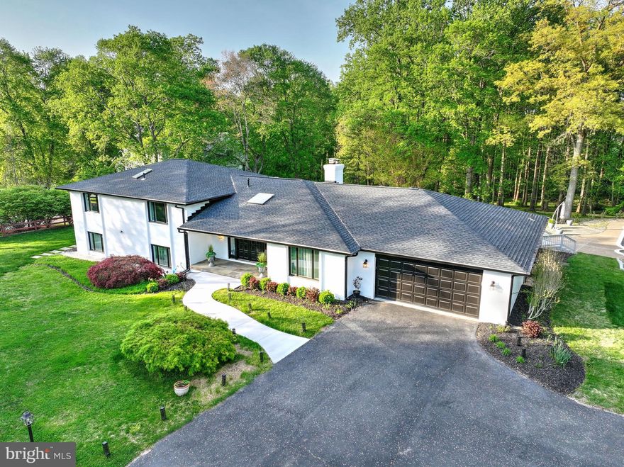 Welcome to 317 Springvale Road, a beautifully updated contemporary brick home nestled on two private acres in the heart of Great Falls. This exceptional property offers the perfect blend of modern comfort and timeless style, with five spacious bedrooms, three and a half baths, and an expansive four car garage - ideal for car enthusiasts or anyone needing extra storage. Step inside and discover light-filled living spaces designed for both relaxation and entertaining, all framed by large windows that showcase serene views of mature trees and rolling lawns.
The heart of the home is its open-concept living and kitchen areas, seamlessly connected to multiple decks that invite you to soak in the spectacular scenery year-round. Imagine hosting summer gatherings by your gorgeous in-ground pool, or enjoying a quiet evening with a glass of wine as you watch the sunset over your private backyard oasis. Recent updates  ensure peace of mind and years of worry-free living.  These include a brand-new septic system (2024), roof (2024), 75 gallon water heater (2022), refurbished deck (2025), and HVACs (2022 and 2024).  
Every detail has been thoughtfully considered, from the elegant finishes to the practical upgrades that make daily life a pleasure. Whether you’re preparing meals in the well-appointed kitchen, unwinding in the luxurious primary suite, or working from home in a quiet corner with inspiring views, this home offers a lifestyle of comfort and sophistication.  The primary bedroom closet adjoins the luxury bath and has just been remodeled.
Located on a tranquil street just minutes from the heart of Great Falls, you’ll enjoy easy access to top-rated schools, boutique shopping, and scenic parks. You can even walk to L'Auberge chez Francois! Prepare to fall in love with a home that truly has it all: space, style, and the perfect setting for your next chapter.  It's time to make your move!  OPEN HOUSE Sunday.  Come see!