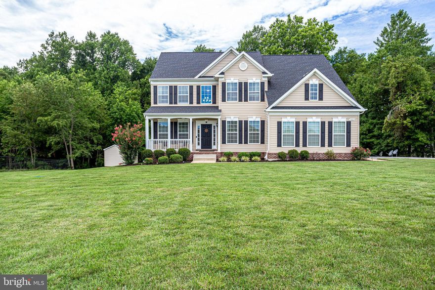 Welcome home!! This gorgeous home sits on 1 acre of land and has over 4000 sqft of space to live in! There are so many bells and whistles that you'll never need to leave! The grand foyer welcomes you into an open floor plan concept, 9-foot ceilings, and hardwood floors throughout the main level. You have your traditional separate dining room and office with crown and chair moldings, but also have the very much desired open floor plan in the kitchen that opens up to the family room. The kitchen is light and bright with white cabinets, gorgeous granite countertops, a beautiful kitchen island, and tons of natural sunlight! It also features a breakfast room that can also be used as a sunroom. From your breakfast room, you can step outside onto your lovely Trex deck and dine al fresco as you enjoy the view and peacefulness of your backyard that backs to woods and trees. Once your done enjoying the serenity of the Nature preserve in your private backyard oasis, relax in your family room that has a gas fireplace and a mantel which is the perfect placement for your TV.  Lastly on the main level, is a convenient bedroom and full bath which is ideal for any guests!The lower level features a fully finished basement with 9 foot ceilings, LVP floors and walk out! As you walk down the stairs, a  charming wet bar that was added in 2018 awaits you! It has white cabinets with butcher block countertops..adding so much character in the basement! A convenient full bath is also in the lower level, along with 2 rooms; one being used as a theatre room and the other as a gym. Ready to rest? There are 4 spacious bedrooms and 2 full bathrooms on the upper level. Master bedroom features a grand walk-in closet, and a massive master bathroom with a separate tub and shower, tiled flooring, and granite countertops. The laundry room is conveniently upstairs right outside your master bedroom. Thanks for stopping by and we hope you make this your home!