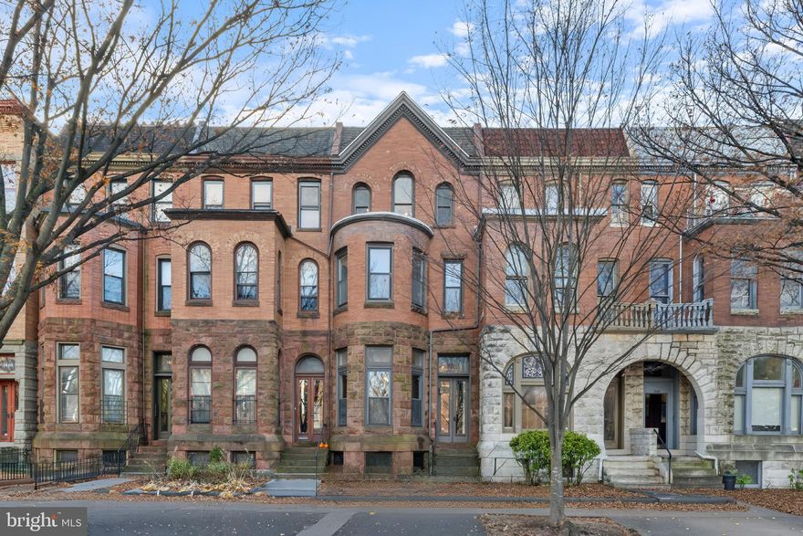 This stunning 1880 Victorian in Bolton Hill offers over 3,500 sq. ft. of beautifully maintained historic charm, featuring original hardwood floors, built-in shelving, five decorative fireplaces, spacious rooms, updated appliances, and a new 2023 boiler. The flexible layout includes six good size bedrooms, two full bathrooms, a first-floor half bath, a versatile bonus space perfect for an office or dressing room, and a full-length third floor ideal for guests or creative use. A brick-paved private patio, generous storage in the full unfinished basement, and a rare parking pad for 2–4 cars enhance everyday convenience. Located across from MICA and steps from coffee shops, restaurants, parks.  Close to Penn Station for an easy commute to DC via MARC Train/Amtrak or to catch the light rail, metro, and the JHU shuttle. Quick access to I-83.  This home captures the best of city living in one of Bolton Hill’s most desirable locations.