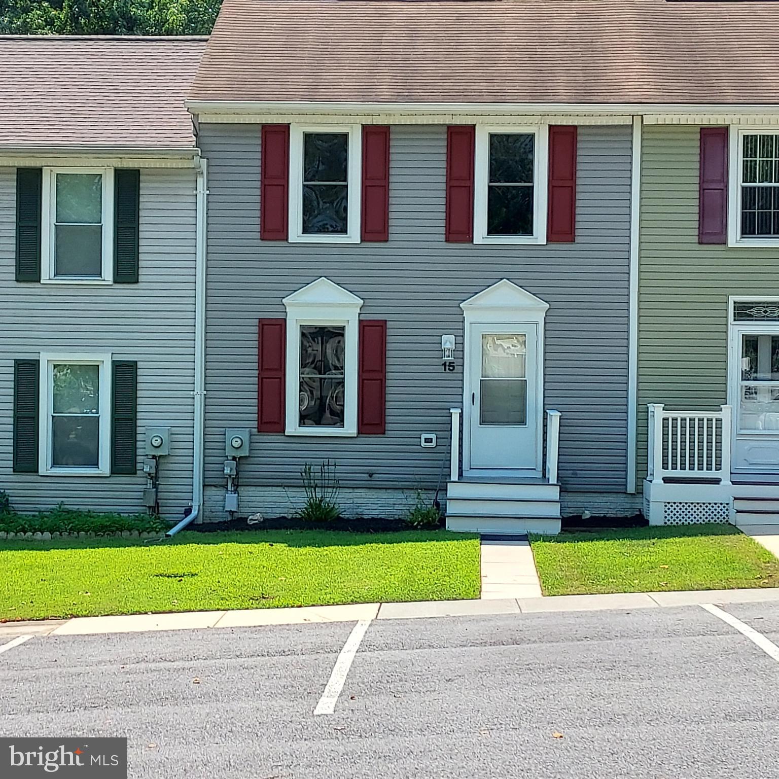 Welcome to this immaculate, move-in ready two-bedroom, two-bathroom townhome. New paint, new carpet, new vinyl flooring in living room and basement bathroom. Public water, sewer, trash, and recycling. Includes washer, dryer, range, refrigerator, and one window air conditioner. Secluded circle. Two parking spaces plus visitor spaces available. Lovely shaded common area. Conveniently located near commuter routes.