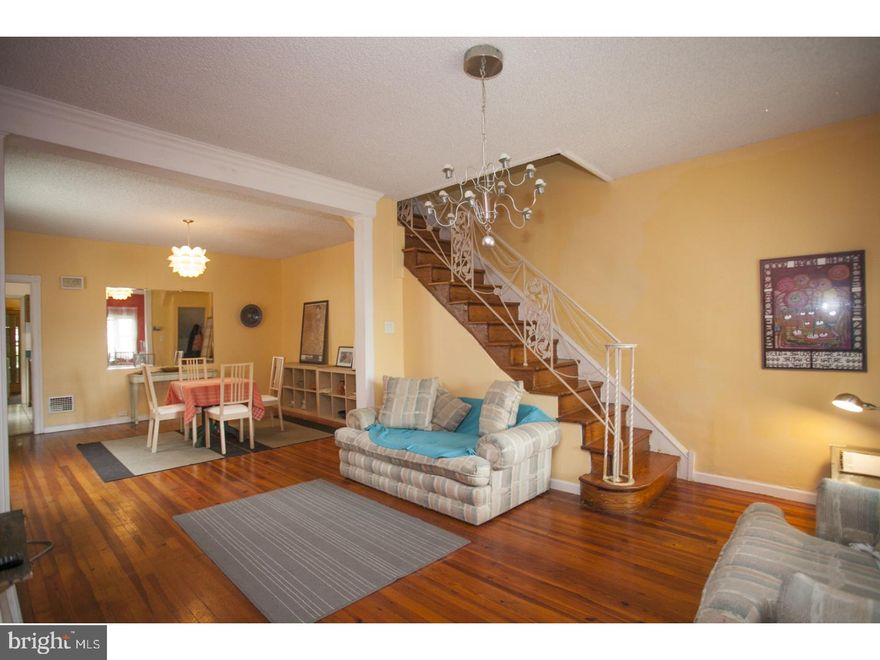 Beautiful end unit home located on a quiet street! As you enter into this classic style row home you are welcomed by an open & spacious living room / dining area followed by the kitchen. Upstairs are 3 great great bedrooms providing ample lighting and comfortable living space. Last but not least is the awesome back yard! The open yard offers a lush lawn, the perfect space for entertaining or relaxing in the sun! Some of the great features of this home are original hardwood flooring, high ceilings, bonus sunroom and a large basement for additional storage. At this location your are close to public transportation, Center City, shopping, restaurants, and I-76 & 95. Don't wait - schedule your showing today!