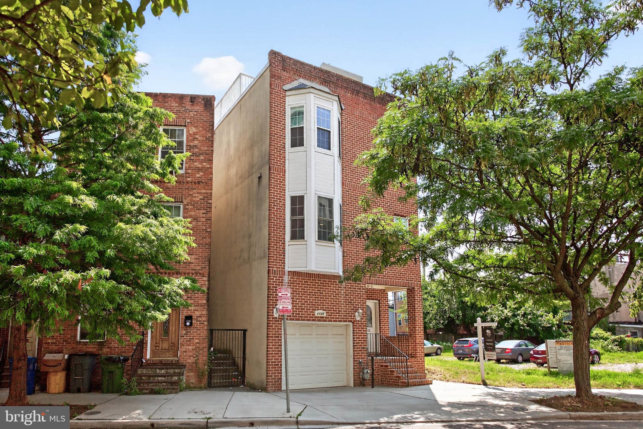 A rare find in Federal Hill! A 5 minute walk to M&T Bank Stadium and Camden Yards, this 3 story SINGLE FAMILY home features a large garage, rooftop deck and open floor plan. The 10' ceilings and natural light make this a unique and exceptional Fed Hill home. The ground floor includes a 2nd entertaining area or 4th bedroom as well as a full bathroom! Upstairs, the main living space is designed to wow your guests! With an expansive kitchen featuring granite countertops, stainless steel appliances, REAL wood floors and tray ceilings! The bedroom level features a generously sized primary suite and 2 additional bedrooms. Walk up one more flight and have a cocktail on your HUGE rooftop deck. This level also features a finished space with a wet bar!