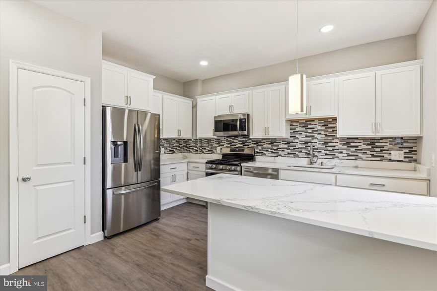 BACK ON THE MARKET........BUYER'S FINANCING FELL THROUGH.....HERE'S YOUR SECOND CHANCE!
 Welcome Home! This Meticulously Renovated Brick Home Is Sure To Capture The Heart Of All Who See It! It Offers Amazing Space, Style, Comfort, Modern Features And Convenience.

From the moment you arrive, you'll be enchanted by the charming front porch, a perfect space to enjoy a morning coffee or unwind in the evening breeze.

Step inside, and you'll be greeted by an interior that seamlessly combines modern features and functionality, with ample room for large pieces of furniture, including a large dining room set that will be great for family celebrations and entertaining. The space is filled with windows all throughout illuminating the stunning finishes, including luxury engineered flooring throughout the first level and recess lighting.

The recently renovated kitchen is a dream for anyone that enjoys cooking. Featuring sleek quartz countertops, tiled-backsplash, stainless steel appliances, ample cabinets and a separate pantry. And with a beautiful breakfast area, it will be easy to entertain while you are cooking. There is also a powder right off the main level to accommodate your guests.

The upper level offers three sizable bedrooms, two of which are large enough to be master bedrooms and a luxuriously renovated bathroom.

The lower level is fully finished with one bedroom and a bonus room (with a closet) that can be transformed into a recreational room, home gym, home office or multipurpose room and is complimented by another beautifully appointed full bathroom with modern fixtures, luxury tile, shower inserts and elegant finishes. It also comes with a designated space ready for a sink or small kitchen cabinet addition shall you decide to turn it into an income producing space (private entrance included).

When you are ready to enjoy more of the outdoors, step in the fully fenced patio to discover a rear deck and huge detached garage that is ideal for mechanic lovers or home project fanatics.

Your guests will appreciate that there is ample parking on both sides of the wide, uncongested street. And since the home is located on a side of town with a mixture of different property types, it feels more private/residential, all without sacrificing convenience to major road, (Ritchie Hwy, 95, 695, 895), shopping and schools.

And to top it off, all systems are new so you can focus on enjoying your new home! See this home asap; you’ll be glad you did!