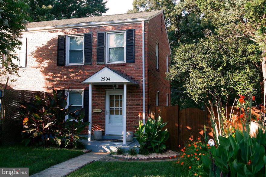 Solid as a rock, post WW2 semi-detached home in great condition. Refinished oak hardwood floors on main & upper levels. Updated modern kitchen w/new dishwasher, microwave oven, & large double door refrigerator/ freezer. Kit walks out to large iron back-porch (covered) w/storage shed underneath. New roof. Driveway. Fully fenced backyard w/side entrance to finished basement. OWNER LICENSED RE AGENT.