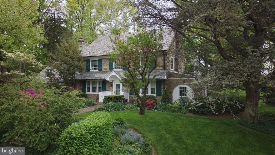 Steeped in the architectural elegance of 1927, this magnificent stone Colonial at 105 E Logan Street offers a combination of historic integrity and expansive acreage in the heart of Montgomery County. Spanning six bedrooms and five bathrooms, this estate is a sanctuary of craftsmanship awaiting a buyer with the vision to oversee the updates and restoration necessary to return this landmark to its full glory. 

The journey begins in a grand hallway with 9-foot ceilings and a grand staircase that connects the sophisticated main floor living spaces. The living room is a masterpiece of light with bay windows at both ends that flood the rooms with natural light and a wood-burning fireplace anchored by built in bookcases.  Proceed through the double French doors that lead to an enclosed sunporch featuring eight windows and stone archways.  A formal dining room with multi-pane windows, built-in cabinet and French doors attribute to the charm of this classic room.  Proceed through the swinging door into the vintage kitchen with walk-in pantry and breakfast area to complete the primary level.  

A standout feature of this property is the dedicated secondary living quarters, perfect for multigenerational living or an au pair. This wing includes two bedrooms, a full bath, and a private living room with its own fireplace and custom built-in bookshelves. The second floor, accessible via a private elevator or the main staircase, serves as the primary sleeping area with four spacious bedrooms featuring hardwood floors and two full bathrooms. For those needing even more space, the home includes a full walk-up attic with for a studio or storage.

Outside, the 0.57-acre grounds are a horticulturist’s dream, featuring a side yard with mature flowering trees, perennial landscapes, and a dedicated grape arbor, all meticulously maintained by a Rainmaker irrigation system. 

Modern conveniences include a ADT security system, maintained mechanicals and HVAC/mini-split systems.

Located in a residential neighborhood, conveniently located near major routes and public transit options with easy access to local eateries and the county courthouses.  With your personal touch and updates, this stately colonial house is ready to be transformed into your new home.  

You are invited to attend the public open houses on Thursday, May 7th from 3PM-5PM and Thursday, May 14th from 3PM – 5PM.  This property is selling at public auction on Tuesday, May 19th at  4PM