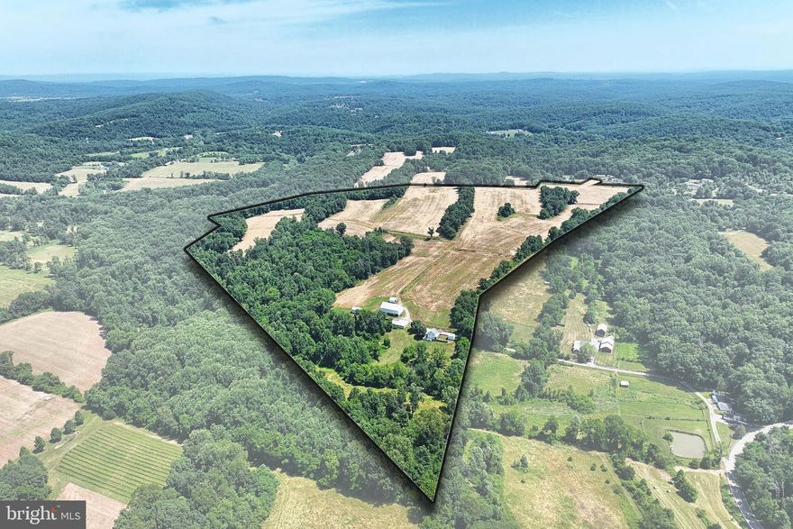 For the first time in 199 years, this 97 acre farm is available to the public for sale! Situated at the end of a private road, this farm features approximately 60 acres of tillable ground, uniquely divided by brownstone fencerows across the entire farm. The farmhouse could use some TLC on the exterior, but the interior has been well taken care of over the years. A steady spring enclosed in a springhouse supplies water to the home, and a small stream flows across the backyard. Beside the house, there is a small, 2 story summer kitchen complete with potato cellar. The early 1900's mortise and tenon bank barn still stands straight and firm on it's brownstone foundation, complete with barnyard wall, and numerous other outbuildings, including a chicken house, implement shed, and corn barn lie nearby ready to be put back into use. The fields lay on a gentle slope, and the woods contain a small amount of timber value, as well as house a number of deer and turkey. There is a 50' secondary access to the rear of the property via Bull Rd should you need it. There are 3 parcels, but all are being sold as one. Dover Township confirmed that the farm could be subdivided one additional time as long as both parcels contain 25 acres.