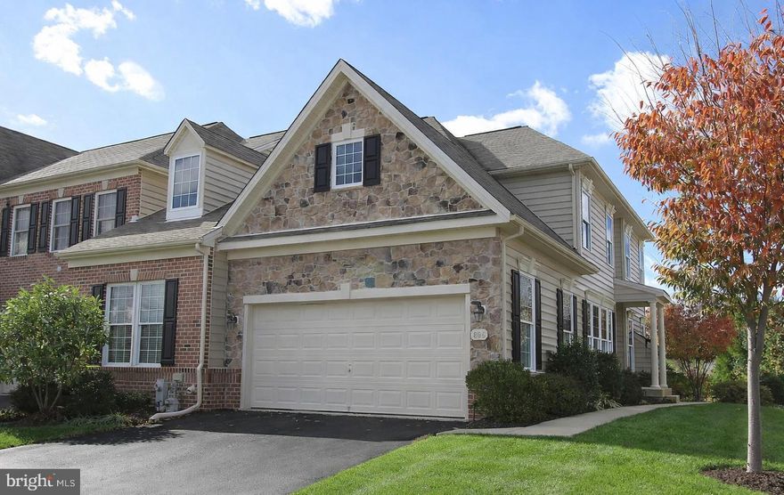 Located in the beautiful Vale Meadows community, this beautiful stone-accented end-unit villa offers elegant design, generous living space, and exceptional functionality in a convenient location just minutes from downtown Bel Air, shopping, dining, and everyday conveniences. Situated on a very quiet street, the home welcomes you with charming curb appeal and a two-car garage.

Step inside to a dramatic two-story foyer featuring hardwood floors and a tray ceiling, setting the tone for this well-appointed residence. The formal dining room offers hardwood flooring, a tray ceiling with crown molding, a classic chandelier, and large windows that create the perfect setting for hosting memorable gatherings.
Across from the dining room, the living room provides a comfortable space to relax, highlighted by a combination of hardwood flooring with a carpeted center area, a ceiling fan, and a gas fireplace with mantel.
The kitchen serves as the heart of the home and features hardwood floors, marble countertops, oak cabinetry, a gas cooktop, breakfast bar, pantry, and generous counter space.
Adjacent to the kitchen, the breakfast nook impresses with cathedral ceilings, hardwood floors, a ceiling fan, and sliding glass doors that lead to the rear patio.

The main-level primary suite offers both comfort and convenience with hardwood floors, a walk-in closet, and a private en-suite bath featuring a double vanity, garden tub, and separate walk-in shower.

A main-level powder room with hardwood floors and pedestal sink, along with a laundry room with garage access, completes the main level.

Carpeted stairs lead to the upper level overlooking the foyer below. Upstairs you will find three additional bedrooms, each with carpet and closets, along with a hall bathroom featuring a single vanity, a shower/tub combination and a spacious sitting area perfect for additional family lounging. The upper level features hardwood flooring throughout the hallway and common areas. 

The partially finished basement expands the living space with a recreation room featuring hardwood floors, a wet bar, and walk-out steps leading to the backyard. The lower level also includes an additional room with a walk-in closet that can be used as an office or bedroom, along with a full bathroom with shower/tub combination and single vanity.
An additional storage room includes a slop sink and offers the potential to be converted into a flexible living space, while the utility area provides even more storage.

Step into a beautifully designed outdoor living space perfect for relaxing and entertaining. The backyard features a spacious paver patio anchored by an elegant pergola with classic white columns, creating a shaded gathering area ideal for outdoor dining or lounging. A built-in stone grilling station adds convenience for hosting cookouts and summer gatherings.
The patio overlooks a private backyard with scenic views and open green space, providing a peaceful natural setting. Mature trees and landscaping add both charm and privacy while offering plenty of room to enjoy the outdoors.
Whether enjoying quiet mornings under the pergola or entertaining guests in the evening, this backyard offers the perfect blend of comfort, beauty, and functionality.

This exceptional end-unit villa combines space, comfort, and elegance in a highly desirable location near downtown Bel Air and all nearby conveniences, making it a truly wonderful place to call home.