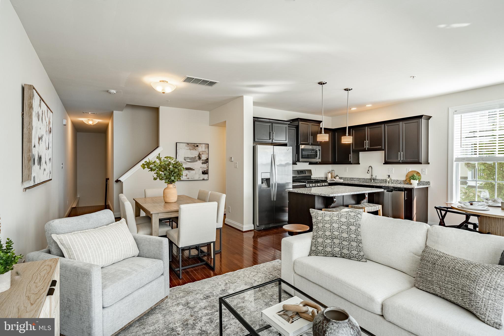 Please use "218 Dana Dr #77, West Chester, Pa 19382" for the GPS address. Welcome to 218 Dana Dr – A move-in ready, beautifully updated townhome in the heart of West Chester Borough! Step inside this bright and modern townhome, where recent upgrades include fresh paint, brand new carpets, a new washer, and more! From the moment you enter, you'll be greeted by neutral tones and beautiful flooring that create a warm and inviting atmosphere throughout the home. The spacious living room is filled with natural light, making it the perfect place to relax or entertain. The open-concept main level flows effortlessly from the living room into the dining area and kitchen, offering comfort and convenience for everyday living and hosting guests. The updated kitchen features elegant cabinetry, stainless steel appliances, sleek countertops, and a large island with bar seating—perfect for casual meals or morning coffee. Just off the kitchen, the eating area opens to your private balcony through glass sliding doors, making indoor-outdoor entertaining a breeze. A well-placed half bathroom on the main level adds convenience for both family and guests. Upstairs, the cozy primary bedroom offers a peaceful retreat, complete with a spacious walk-in closet and an updated ensuite bathroom featuring a double vanity and a glass-enclosed, stand-up shower. A second bedroom and full hall bathroom complete this level. On the top floor, you'll find an additional primary bedroom with en-suite bathroom! Enjoy all the charm of living in West Chester Borough—tucked in a quiet community yet just a short walk from the vibrant restaurants, shops, and culture of downtown West Chester. Don’t miss your opportunity to own this turnkey townhome in one of the most desirable locations in the area—schedule your tour today!