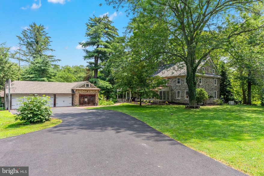 Step back in time and discover Willowstone Farm, an enchanting estate built in 1793, nestled on a
sprawling 2-acre lot. This beautiful home preserves the original detail and hand-hewn artisanship of its era, seamlessly integrated with modern conveniences. What truly sets this property apart is its breathtaking setting,  surrounded on 3 sides by the majestic Peace Valley Park. Picture waking up to sweeping views of nature and enjoy direct access to endless walking trails, all without the responsibility of maintenance. The captivating stone farmhouse includes a detached 3-car garage and an  812 sq ft in-law apartment on the ground level. This versatile space offers a full kitchen with dishwasher and built-in microwave, a large great room with two sets of glass doors opening to the serene rear yard,  a generous bedroom and a full bath with washer/dryer. Attached to the garage is a convenient workshop, large storage area, and above, on the 2nd level, a bright 382 sq ft 2-room office with full bath, heated and air-conditioned for year-round comfort. Combined, the main house, apartment, and office offer an impressive total of 4,425 sq ft of finished living space. For added convenience, the main house, apartment, and office utilities are all separately metered. From the driveway, a welcoming open, covered porch invites you into the farmhouse, leading you directly into the glass-enclosed sunporch. This wonderfully cozy four-season room, bathed in natural light from its walls of windows and warmed by a tiled floor and heating, is truly a terrific spot for entertaining or simply unwinding. Step inside the center hall, running the entire length of the home, and see the warmth of wide plank pine floors that stretch gracefully throughout. To the left, the great room beckons with its inviting atmosphere, anchored by a beautiful fireplace featuring a woodstove insert. Here, you will appreciate the many original details, including charming windows with wide windowsills, elegant crown molding, and practical built-in corner cabinets. Across the hallway, the living room showcases the first of several decorative fireplaces found throughout the home. While no longer active for wood fires, these fireplaces add a touch of timeless charm. This room also includes a convenient half bath. Next, prepare to be charmed by the newly remodeled farmhouse kitchen. This heart of the home boasts expansive cabinetry, gorgeous wood floors, and a grand decorative fireplace with a mantle. Culinary delights await with a built-in microwave and wall oven, a 5-burner gas stove with a decorative hood, and a large island featuring a classic farmhouse sink. There is also plenty of room for a large breakfast table, making this space perfect for gathering with loved ones. Ascending the stairs, you will arrive at a wide landing offering a built-in bookcase and a large closet housing the washer and dryer. On the second floor, one of the many delightful features is the presence of beautiful exposed beams, adding character and history to each space. The primary bedroom provides a serene retreat, complete with a newly renovated ensuite bath and a spacious sitting room with two closets. Two additional bedrooms and a newly renovated full hallway bath complete this level, offering comfort and privacy for everyone. Back downstairs, at the front of the house, envision yourself relaxing on the wide, rocking chair covered front porch. This idyllic spot offers a peaceful view over the expansive lawn. As you explore the grounds, you will also discover a charming springhouse and a practical root cellar, which could easily be transformed into a fantastic wine cellar. Despite its serene historic setting, Willowstone Farm is only 10 minutes from Doylestown Boro's shops, dining and Septa train. All of this in the highly regarded Central Bucks School District! Recent updates ensure peace of mind and modern comfort. (See list of updates in last picture) Make this your  home today!