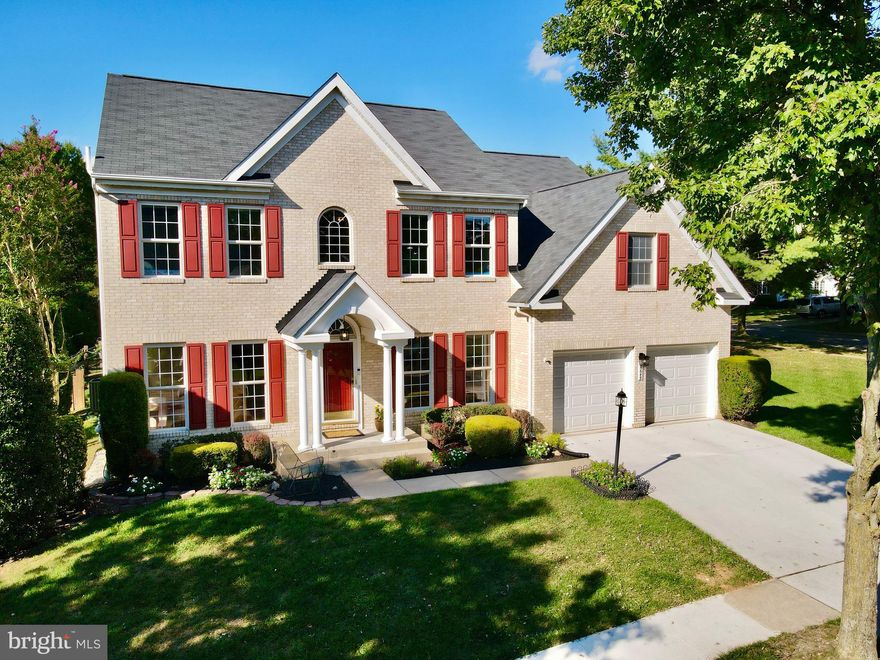 **Check our video tour on the property** Welcome to this beautiful brick front light-filled home in the heart of River Hill! Walking up the new driveway (2021) you will immediately notice mature landscaping. Stepping through the front porch entry with palladian window you will come into the two story foyer with overlook to the upstairs. Notice the oak hardwood floors throughout the first floor (2017) as you walk through the bright living room and dining separated by two columns. A side hallway leads to the first floor remodeled powder room and private rear office. Continuing back to the rear kitchen you will be impressed by the remodeled kitchen (2017) with expanded island, Stainless steel appliances, granite countertops, Reva cabinets and undercabinet lighting. A large breakfast area leads into the wonderful family room with  10 foot ceilings, walls of Palladian windows that let the light pour in and a warm gas fireplace.  The main floor is completed with a relaxing screened porch with ceiling fan for those family gatherings and quiet mornings.  Stepping up the stairs to the second floor you will find an expansive master bedroom suite with sitting room, cathedral ceilings, TWO walk-in closets and a recently remodeled (2019) spa bathroom with a freestanding whirlpool and airjet bathtub featuring bubble, jets and lights. The shower has 3 types of shower heads including a relaxing rain shower.  There are three additional bedrooms, a remodeled bath with dual sinks (2016), granite counters and a separate and convenient laundry room. The lower level features two large family room areas perfect for a game room or a media room.  The finished area is completed with a exercise room and full bath. There is also a workshop area and a large storage area.  On the exterior you will find a fenced rear yard (2019), patio area plus a large open side yard.  Additional features and upgrades to this home include upgraded roof replacement and vent collar (2015),   Dual Zone Programmable Climate Control HP (2013) for Upstairs, Gas furnace and A/C (2014) for main level and basement, Hot water heater (2014), Maytag washer/Dryer and vinyl flooring in upstairs laundry (2017), and Cellular Shades (2015).   Brand new lighting (2022) in foyer, dining room, family room, hallways, main level bathroom and front entry/garage. Many of the windows have been replaced. The home has just been repainted and brand new carpet (2022) has been installed upstairs.  This home is within walking distance to both the elementary and middle school. The current owners have greatly enjoyed this home and neighborhood while raising their family. This wonderful home is move-in ready for the next family to start making their memories.