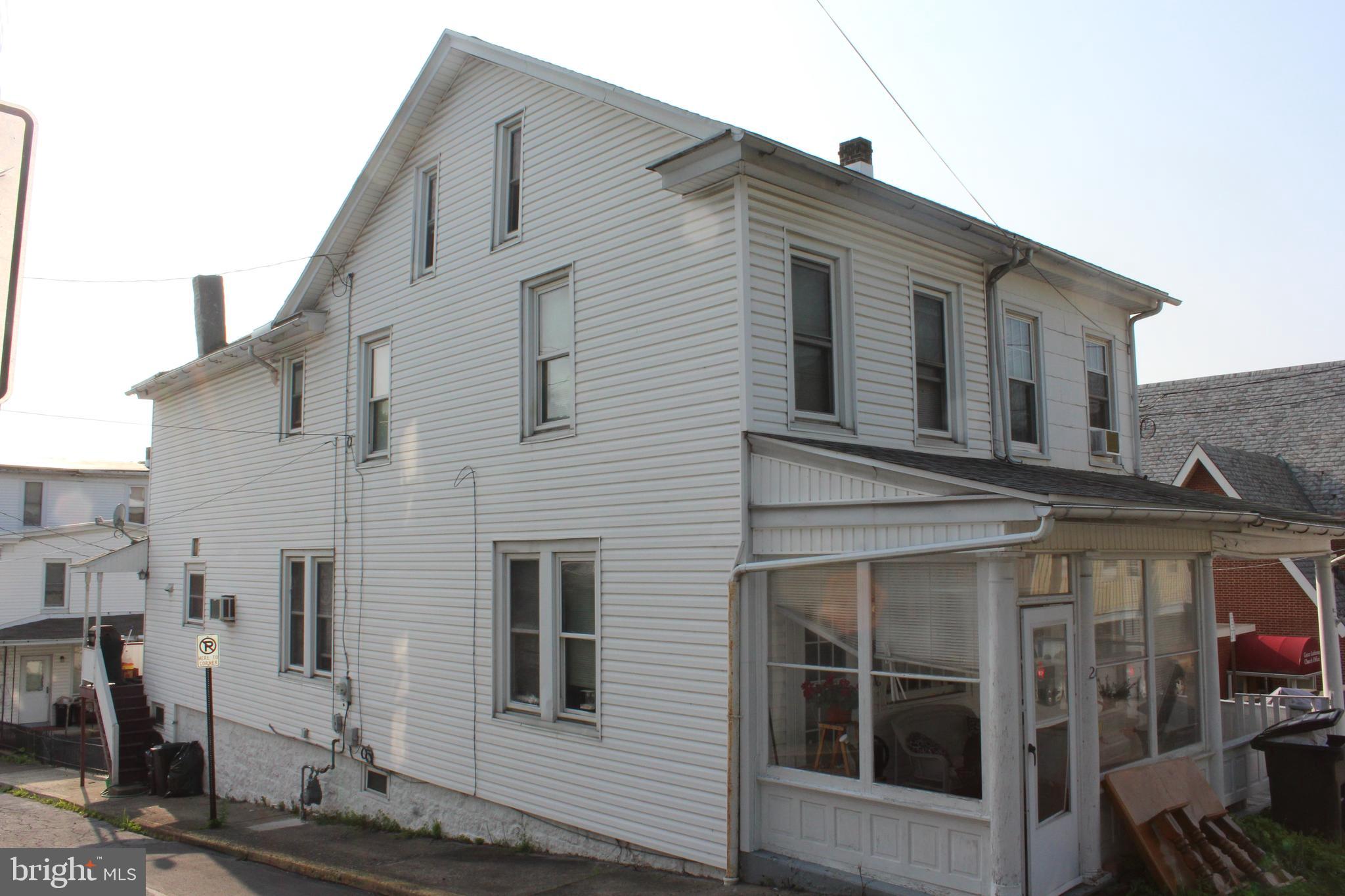 Large home on a corner lot in Shamokin. Enter into the home from the enclosed front porch to the large living room with high ceilings and plenty of room. Dining room with beautiful build in wood cabinetry for storage of your family treasures. Open staircase to the second floor. Kitchen has the large wooden cabinetry as well which opens to the covered back porch and access to the street. Second floor has three bedrooms and recently remodeled bathroom with tub and shower combination. Access from the second floor the the partially finished attic.