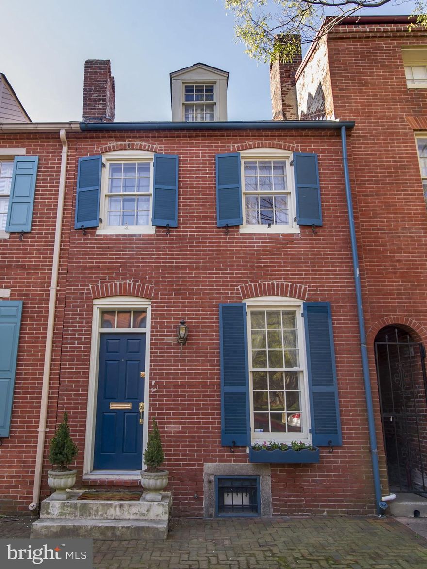 Charming  town home in the heart of historic Otterbein. Original wide plank 1800's hear pine floors have recently been refinished and are a beautiful enhancement to this wonderful 2 bedroom home.  The main level features a living room, dining room and a bright, white kitchen leading to a glorious, large landscaped rear yard with sunny southern exposures and access to popular Hill Street park just beyond.  The second level is a large primary bedroom and full bath with glass shower and separate stand-alone claw foot tub.  The top floor bedroom or home office  features sliding doors and balcony w/beautiful sunrise and park views. The lower level was recently updated with fresh paint and new flooring and provides wonderful versatile space for a playroom, "man cave" or workshop.  All roofs replaced 2019.  Very few homes come on the market on this tree lined block. Wonderful neighborhood location near the I-395, the MARC train to Washington DC, Camden Yards, Raven's Stadium and all the convenience of Federal Hill and the Inner Harbor.  Just in time for Spring blooms! Schedule a showing today.