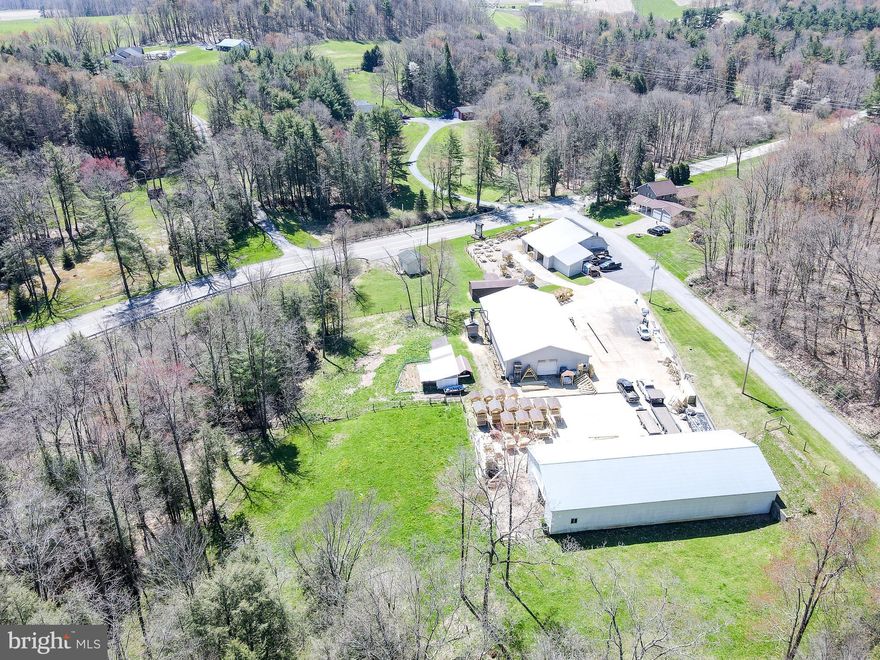 Welcome to a rare opportunity in the real estate market! there is also a stable and pasture on the property. The infrastructure on the property is impressive, featuring 2 warehouses, a shop, and an office totaling approximately 10,000 square feet. What's unique is that the house and shop buildings are heated by a hot water wood-fired furnace, ensuring efficient and sustainable operation. Don't miss out on this exceptional opportunity to own a piece of real estate that combines business and residential tranquility