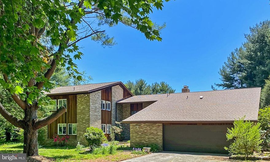 I can't wait to show off this house...these Architect/ Diplomat owners were ahead of their time!  Fantastic, retro vibes with this brick and redwood, mid-century modern home on a beautiful, level two and a quarter acres close to Potomac Village.  Inside you'll find a treasure trove of fun details including a sunny cathedral kitchen, a fireplace family room with custom tile surround, vintage bath tiles and incredible light fixtures. The main level, features 13 ft. vaulted cathedral ceilings throughout the entrance, living room, dining room and kitchen areas.  A spacious Living Room with a wood burning fireplace and access to the pergola/grape arbor covered patio, a private Dining Room, a fantastic large kitchen with a separate eating area, connecting to a skylit greenhouse with a sitting area and a Hot Tub.  A Family Room with access to the rear yard, a Primary Suite with a nursery/sitting/office area, with a laundry room close by.  Upstairs there are three generously proportioned bedrooms and two full baths. T he Lower Level offers a great recreation room with a wood stove, an in-law/au pair suite with a kitchenette, full bathroom and a separate entrance. There is also a large storage room and 2 utility closets.  Bring your landscaping dreams to this private, level 2 1/4 acres. The grounds are awash in sunshine offering lots of places for gardening and landscaping. Public Water and Sewer too!!  Easy access to major commuting routes via either River Road or South Glen Road. Churchill Schools! Make time to see it now. It's a winner!!