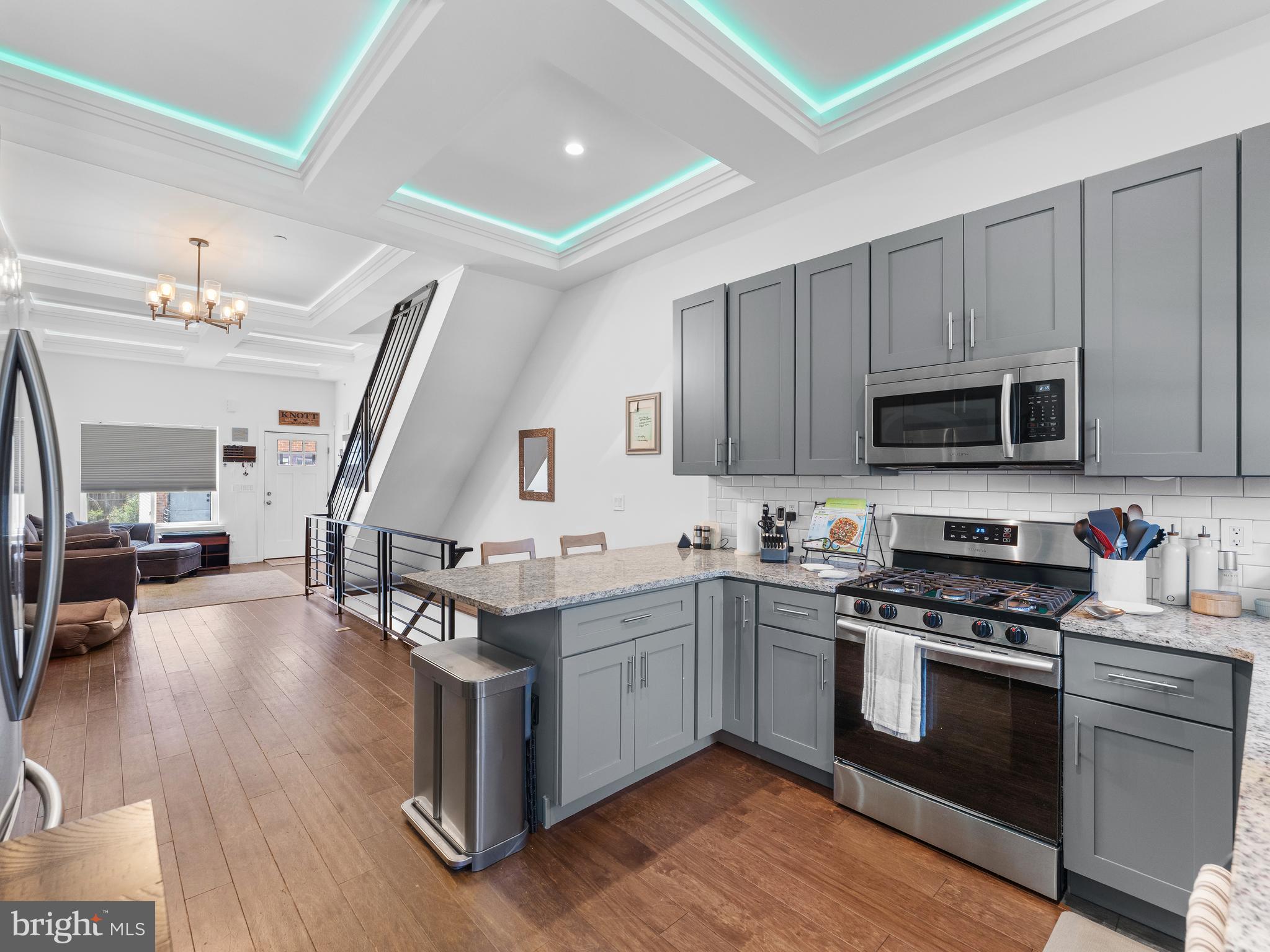 Welcome to 1913 N Orianna Street—a stunning 4-bedroom, 3-bathroom end-unit townhome offering the perfect blend of space, style, and city living. Built in 2021, this contemporary 3-story home offers over 2,000 square feet of thoughtfully designed living space, including a rooftop deck along with a fully finished basement. As a bonus, there are six years remaining on the coveted TAX ABATEMENT. Step inside to discover high-end finishes throughout, including hardwood floors, central AC, custom coffered ceilings, and eat-in kitchen. The main level features an open-concept layout with a chef’s kitchen outfitted with stainless steel appliances and ample cabinetry—perfect for both entertaining and everyday living. Upstairs, the full-floor primary suite offers a private retreat with his-and-hers walk-in closets and a spa-inspired ensuite bathroom featuring dual vanities and dual shower heads. Two additional spacious bedrooms and a full bath are located on the second level. The fully finished basement includes a large fourth bedroom or flex space, another full bathroom, utility closet, and a Samsung washer/dryer—ideal for guests, a home office, or additional living area. One of the home’s show-stopping features is the massive rooftop deck complete with a wet bar and wine cooler, where you’ll enjoy breathtaking panoramic views of the Center City skyline—perfect for relaxing or hosting friends. Located just a short walk to public transportation and steps from the vibrant neighborhoods of Northern Liberties and Fishtown, this home offers unbeatable access to restaurants, cafes, and shops. Don't miss this incredible opportunity to own a modern gem in one of Philly’s fastest-growing corridors. Schedule your private tour today!