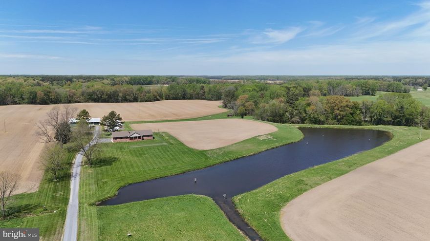 Talbot County Farm With Country Home, Multiple Outbuildings And Tillable Ac
This exceptional farm in Talbot County, Maryland, presents a rare opportunity to own a highly productive Eastern Shore property that combines agricultural value, quality improvements, and premier recreational appeal. Situated in a region known for its fertile soils and strong farming history, this 90 acre home farm offers a balanced mix of tillable acreage, improved structures, and wildlife habitat, making it well-suited for farming operations, outdoor recreation, and long-term land investment. The property has a proven track record of row crop production, including corn, soybeans, and wheat. A diverse and productive soil profile supports continued agricultural use, with primary soils consisting of Mattapex silt loam and Nassawango silt loam across the majority of the fields. Additional areas include Mattapex-Woodstown soils located within previously enrolled CRP sections and wooded portions of the farm. These soils are well regarded across the Eastern Shore for their consistency and productivity, providing a solid foundation for both commercial farming and conservation practices. The farm is zoned agricultural, allowing flexibility for a variety of uses, including crop production, recreational enjoyment, and potential enrollment in conservation programs. A large portion of the acreage is tillable, offering income potential or lease opportunities, while the remaining mix of timber and habitat enhances the property's recreational value. At the center of the property sits a well-maintained 1,966 square foot brick ranch-style home built in 1997. The residence offers three bedrooms and two full bathrooms and has been thoughtfully designed for both comfort and functionality. The main living area features a spacious living room with a knotty pine accent wall and bowed window that brings in natural light. The dining room includes chair rail detailing, tongue-and-groove paneling, and a built-in glass-front cabinet, creating a functional and inviting setting. The kitchen is well-appointed with wood cabinetry extending to the ceiling, crown molding, stainless steel appliances, and a center island with seating. A pass-through connects the kitchen to the dining area, improving flow for daily use and gatherings. French doors lead to a sunroom that overlooks the surrounding farmland and wooded edges, providing a consistent view of the property throughout the seasons. The primary suite includes a private bathroom with a deep jetted soaking tub. Additional features of the home include a covered front porch and an attached two-car garage. Supporting the agricultural operation are several outbuildings, including a milk house and two additional structures, highlighted by a custom-built steel building. These improvements provide space for equipment storage, workshop use, and potential game processing. From a recreational standpoint, this Talbot County farm offers strong hunting opportunities. A large pond, complete with a strategically placed hunting pit, is heavily utilized by migratory Canada geese during the season. The combination of open ground, water, and surrounding timber creates an ideal setup for waterfowl hunting. The property also supports a healthy population of whitetail deer, adding to its appeal for hunting and outdoor recreation. For buyers seeking additional acreage, an adjoining 82.54 acre tract is also available. This parcel includes a large portion of tillable ground, with sections previously enrolled in CRP. The additional tract provides an opportunity to expand the farming operation, increase recreational use, or secure additional investment acreage. It may be purchased together with the home farm or separately, offering flexibility for a range of buyers. It's l


Property taxes shall be based on the acreage as determined by the Buyer’s survey and the acreage conveyed. Taxes will be prorated proportionally from the total parent tract of 582 acres.