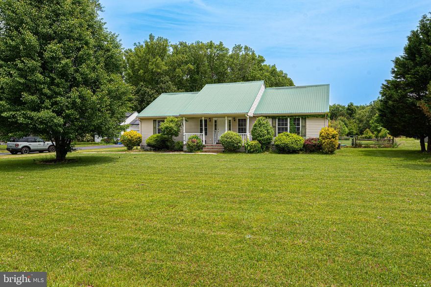 This Country Style Rancher is just what you have been waiting for!  Fall in love with this 3 Bedroom 2 Full Bathroom, on a well-maintained established lot of 1.24 Acres, that is conveniently located in Pittsville.  Elegant Portico entry leads to living area that is Bright and Cheerful.  So let the sunshine in!  Spacious kitchen features stainless steel appliances, breakfast bar, centrally located kitchen island, abundance of natural wood cabinets, large double sink, enhanced with a kitchen window that overlooks the back patio and back yard.  Primary bedroom featuring a large bathroom.  Utility room with Washer and Dryer. Featuring a TWO Car garage.  Landscaped back yard, is equipped with large shed, fenced in yard, and large screened in Porch.  Enjoy the fruits of nature with various fruit trees!  Large spacious porch includes stylish ceiling fan, and rear entry to home though sliding door.  FRESH paint and ready to enjoy!  Metal Roof!   Central A/C. Make this your home, it is just what you have been looking for!