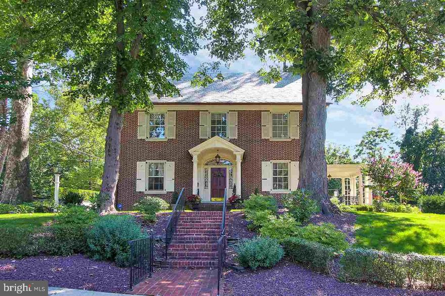 Architectural masterpiece! Lovingly maintained by generations of owners, this three story colonial retains much of its original charm. If you enjoy high ceilings, wood floors, custom mouldings and period bathrooms, please come visit. Extra bonus features: updated kitchen, second floor laundry, double lot, detached two car garage and a super cool man cave!