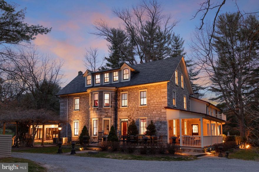 Easy access to Delaware Canal Towpath & Fabulous River Valley! As you approach this stately, refined early fieldstone Victorian with its hand cut quoins, impressive bay window & eye-catching dormer you also capture a sense of tranquility evoking a simpler time. Notably, this property rests on an original part of the first land grant in Solebury Township given by William Penn to George Pownall a Quaker in 1682. Built when proportion was respected and attention to detail was standard. This remarkable home truly enjoys a parklike setting on approximately 2.7 acres pleasantly positioned amongst towering pine, Kentucky coffee, ornamental trees & a myriad of shrubs & perennials. A magnificent age-old catalpa tree & wisteria covered pergola add to the mix. Dry laid stone walls create a backdrop for a glorious stone patio w/ brick border looking on a reflecting pool w/ a whimsical cherub fountain. What a great place for an evening soiree. Abundant windows throughout, many of them arched, bring the outside in. Several rooms on the main floor open to stone walkways, patios and a sheltered covered porch. You enter this remarkable home through a period double door looking on to the central staircase which divides both the elegant living room w/ mantled fireplace and an adjacent family room, both w/ lofty ceilings. There are so many original architectural features & qualities to enjoy as you move through this splendid yet relaxed home. Crown moldings, fine woodwork, chamfered plaster, deep windowsills, wainscoting, original hardware, hardwood & wide pine floors and subtle accents add to its unique qualities & character. A den offers tall original cabinetry, plank paneled walls & custom half bath. There is an adjacent laundry. The dining room w/ pine floor is complemented w/ wainscot & original paneling. It opens to an enclosed sunroom. The perfect place to relax & read a book. You also have access to an open covered porch to while away an afternoon & seasonable dining. The country kitchen w/ center island offers abundant cabinetry, granite counters & decorative backsplash offering generous storage & workspace. Stainless steel appliances include 5 burner gas cooktop, 2 convection ovens, custom vent exhaust, dishwasher, upgraded refrigerator & wine cooler. An accessory half bath at this location completes the first floor. The main bedroom suite w/ French door opening to a balcony offers an adjacent sitting room w/ lots of custom built-ins. The “wow” factor can be enjoyed in its luxurious custom bath w/ heated floor, featuring eye catching oval soaking tub, oversized ceramic tile rain shower w/ hexagonal marble accents & seamless door, double vanity sinks w/ quartz counters & custom lighting. There are 3 additional bright & cheerful bedrooms plus 2 beautifully appointed custom tile & marble baths. Pine floors throughout add to this lovely home’s personality, workspace area and additional linen storage closet finish the second floor. Third floor sliding stained glass doors open to a spacious light flooded flex space w/ random wide pine floor & a wall of window seating. There is a separate office plus an additional bedroom for guests framed by large arched windows. A wonderful “bonus” is the fabulous carriage house w/ a stunning custom ceramic tile bath w/ heated floor, expansive sliding doors, ship lap walls & original elements of exposed beams and a stone fireplace adding to its understated country feel + well-planned workspace/food prep area featuring quartz counters & stainless refrigerator. All these amenities create an ideal place for celebrations & large family, friends’ gatherings. Other perks adding value include a detached garden shed, exterior shower, generator, updated heating & air-conditioning and a myriad of improvements. A place to enjoy, relax, & savor life! Literally, a few minutes to New Hope & Lambertville’s fine restaurants and shops. Convenient to Princeton, New York & Philadelphia.