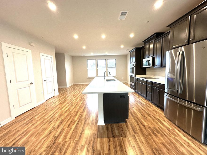 Immaculate, Luxurious , NE Facing Brand NEW ,  3 Bed 2.5 Bath 1 Car Garage JULIANNE MODEL Condo Townhouse in Heart Of HERNDON is waiting for their first tenants.   MAIN LEVEL Features : Beautiful Gourmet Kitchen with Extended Counter Top, Lots of cabinets,  Spacious Pantry, Additional Storage Closet. GE Profile Stainless Steel Appliances -  Double Wall Oven, Cooktop, Built In Microwave , Dishwasher. Formal Living and Dining Room. Enjoy your ME TIME  in  Relaxing Balcony with additional storage closet.  Hardwood floors on entire Main level. UPPER LEVEL Features : 2 Decent Size Bedrooms with closets, Hallway Bath with Dual Vanities,  Soaking Tub.  Master Bedroom having ** Spacious Walk In Closet**.  MASTER BATH Features : HIS and HER Separate vanity,  Standing Shower.  Repair Deductible $100.  Walk to restaurants & shopping, minutes  to Innovation Metro , commuter routes and Airport. Available NOW.