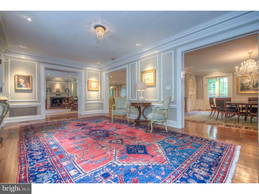 AMAZING VALUE...Don't miss your opportunity to own a piece of Maine Line history.This magnificent grand manor georgian brick estate property majestically sits amongst 2.5 of the most  picturesque acres Radnor Township has to offer. It exudes a sense of grandeur from the moment you pull down its private drive as a pebbled and brick walled courtyard gracefully beckons one inside into an era of by-gone elegance. The beautiful Foyer seamlessly flows into all of the formal rooms,featuring exquisite millwork, gleaming hardwood floors,and gallery picture lighting. The handsome Library has cozy fireplace with built in glass panned bookcases, while the expansive Living Room with glorious fireplace has French doors opening directly to the flag stoned patio which extends the entire length of the back of the house. A covered Loggia off of the Living Room with arched brick walls defines the properties soul as ...."this home was built for entertaining"!! And the formal entertaining opportunities continue with luxurious Dining Room with grand fireplace and  french doors also opening to the flagstone patio overlooking the properties koi pond and formal gardens. In perfect harmony a new wing was added to the house with unparalleled attention to detail providing all modern amenities sought after today. The open floor plan features a wet Bar area, gourmet Kitchen, Breakfast Area, and exquisite two story Great Room with floor to ceiling woodwork. An informal Powder Room and Mudroom conveniently provides access to both of the two car Garages and Basement completing the First Floor. A sweepings staircase leads one to the Second Floor where a glorious Master Suite can be found with fireplace, marble Master Bath, and porch overlooking the breathtaking setting. There are 4 additional Bedrooms with Three Full Baths. The Second Floor is completed by an amazing Exercise room which opens to a two story outdoor lap pool that captures the magnificent setting. The Third Floor has two wood paneled Bedrooms, Full Bath and expansive Storage Space. This grand property built 1926 in is one of the Radnor Townships landmark estate properties that has been modernized for today's lifestyle while preserving and maintaining its Main Line grace. The grounds are absolutely breathtaking and location is within walking distance to downtown Wayne!!