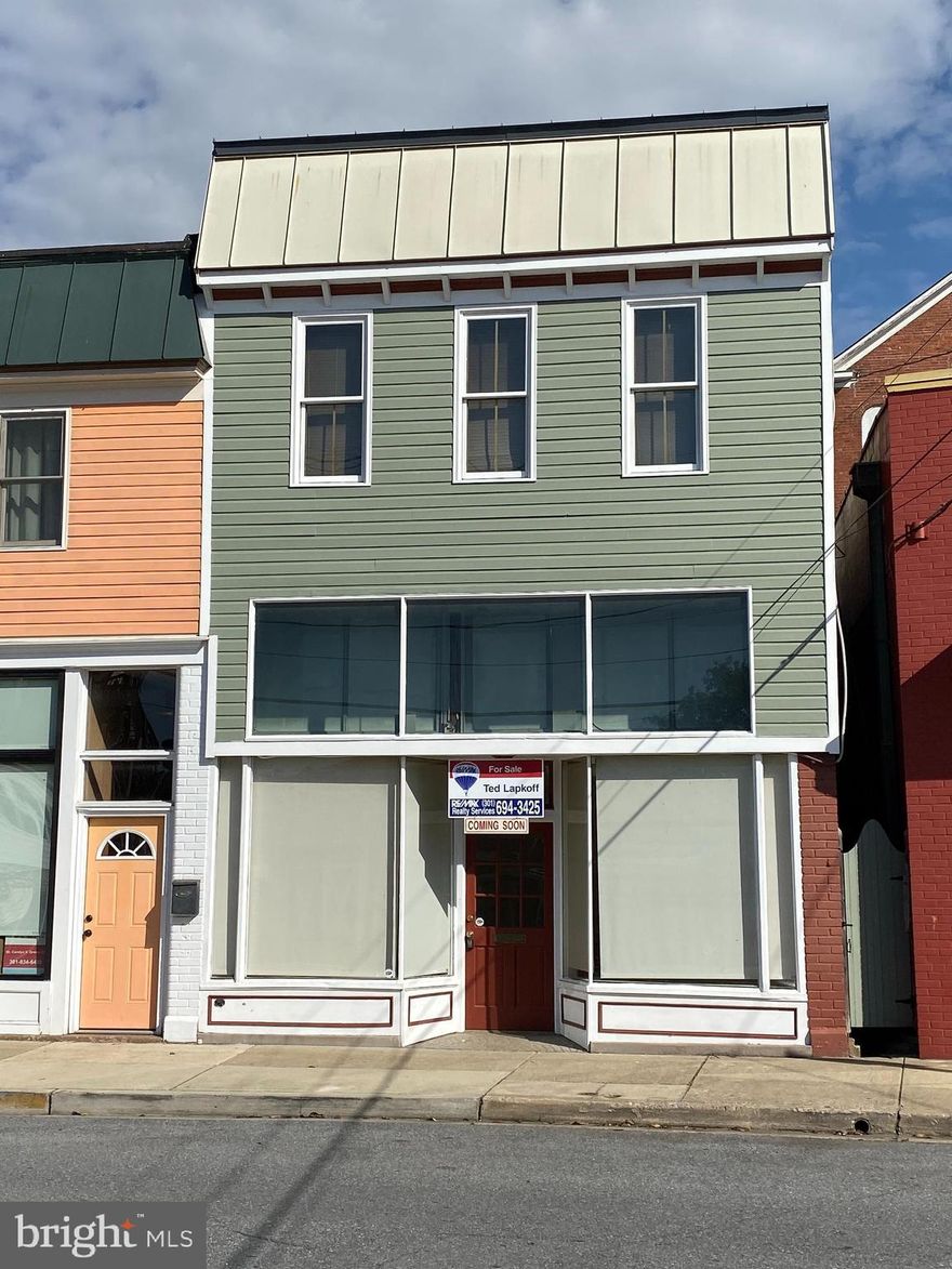 Opportunity KNOCKS!!!!!!!!!!  Mixed use building in Busy Downtown location*  High demand rental area with easy commute via MARC Train downcounty.  Also, easy access to Virginia commuters. Hundreds of MARC Rail commuters daily!  Great traffic count for your business needs and exposure!  First floor commercial space, (currently vacant) was practicing Veterinary office and Grooming Room for over 40 years.  Pick up where they left off.  Great space, BRING your business, creativity and flourish.  Directly across street from Potomac River and Marc Rail.  Get in on the ground level of emerging Brunswicks growth* 
 Upstairs is a very Spacious 2 Bedroom apartment w/updated Kitchen with Quartz counters.  Beautiful wood floors, separate Laundry room, very versatile floorplan.  Long term tenant on month to month lease would like to stay if possible.  OR, bring your own business, belongings and start building equity.  
Fish, float and play at the Potomac River! Ride your bike, or hike the C and O Canal towpath.
Walk to the MARC Rail if you are commuting.  Brand New metal roof, gutters and downspouts.  New HVAC unit on main level. This property shows extremely well. Brunswick Main Street program often has grant funds available for property improvement.  The owners of this property have participated and received grant funding of 50% of total project on 2 separate occasions. Maybe the new owners can apply for grant money???  For further info please check with Brunswick Main St.