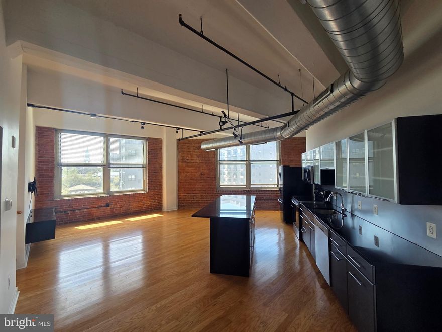 *Open houses this week- 4pm til 6pm on Weds, Thursday 4/23 at 4pm til 6pm  April 22nd and Saturday 4/25 from 12pm til 2pm!* Welcome home to 444 North 4th Street, Unit 704! This stylish loft-style 1-bedroom, 1-bath condo in the heart of Northern Liberties blends modern design with effortless city living. Featuring 9+ foot ceilings, rich hardwood floors, and two full walls of windows, the open-concept layout is filled with natural light and offers a bright, airy feel throughout.
The kitchen is equipped with sleek appliances—all included—flecked countertops, ample cabinetry, a stainless steel refrigerator, and a wine fridge, flowing seamlessly into the spacious living and dining area—perfect for entertaining or relaxing at home. The generously sized bedroom includes large closets with custom built-ins, while the full bathroom showcases clean, contemporary finishes.
Additional highlights include in-unit stacked laundry, a private storage space with built-in shelving, and low monthly condo fees that includes parking!
This pet-friendly building offers top-tier amenities including a 24-hour front desk, gated parking, fitness center, bike storage, and on-site maintenance. The recently renovated lobby and exterior add to the building’s industrial-chic appeal.
Located between Northern Liberties and Old City, you’re just steps from some of Philadelphia’s best restaurants, cafes, shops, and nightlife, with easy access to I-95 and I-676. Don’t miss your opportunity to own in one of the city’s most sought-after neighborhoods!