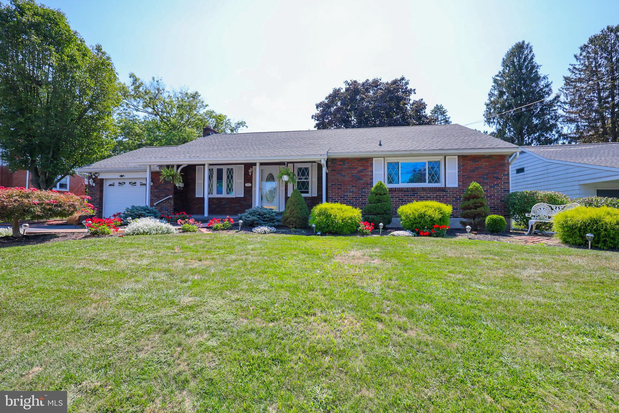 Don't wait schedule your showing for this charming red brick ranch – a 3-bedroom, 2-bathroom home featuring a custom kitchen with warm wooden cabinetry, a cozy living room with a gorgeous stone wood-burning fireplace, and a spacious sunroom with tile flooring, a brick accent wall, and beautiful skylights.
You will also enjoy the beautiful, cozy finished lower-level family room with a beautiful brick hearth - ready for your coal/wood/pellet stove! There's also a laundry closet, a workshop with built-in cabinets, and a cedar closet. Enjoy the convenience of a one-car attached garage, plus outdoor highlights that include a storage shed, a koi pond (complete with koi), and a beautifully mature, landscaped level yard.
*Roof replaced 2022!*
Fabulous, walkable location near Akron Elementary school! Easy access to Rte. 222 / 30 / 283