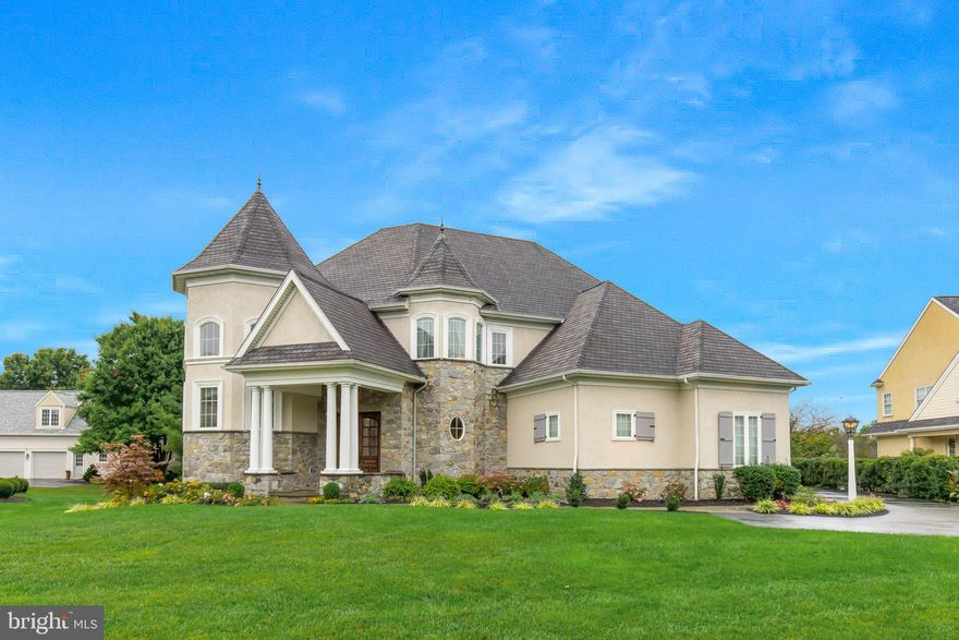 As you approach the stone walkway leading to the grand mahogany doors on the expansive covered front porch, it becomes clear this residence is a true work of art. The travertine-tiled entryway opens into a stunning 21-foot gallery, featuring illuminated moldings and niche alcoves. This luxurious home invites you into an airy family room with floor-to-ceiling windows, offering a breathtaking view of the backyard and the golf course. The open-concept design highlights a dream kitchen, complete with a 6-burner Viking range with a griddle, dual ovens, a built-in Viking refrigerator, dishwasher, and microwave. A large island, equipped with a vegetable sink, provides ample space for gatherings, while the walk-in pantry, adorned with an etched glass door, offers generous storage. For additional entertaining, there’s a butler’s pantry with a unique copper sink and beverage fridge, leading to the refined dining room with a double tray ceiling and ambient lighting. One of the home office options, located in the front turret, boasts abundant natural light and a soaring two-story tray ceiling, making workdays something to look forward to. The first-floor primary suite offers a serene retreat, complete with a luxurious en-suite bath. Outdoor living is equally inviting, with a screened porch featuring a gas fireplace and an expansive bluestone patio large enough for any social gathering with a gas firepit, perfect for S/mores.  Overall a private setting for outside recreation while overlooking the black tee box on the 16th hole of the luscious bent creek golf course. The finished lower level provides extra space for a media room, along with two additional versatile rooms that can serve as bedrooms, a gym, playroom, or office. This impeccably maintained home, located in the prestigious Bent Creek Country Club community, is a rare find. Its convenient location near the vibrant areas of Lancaster and Lititz adds to its appeal. Set aside time to explore this remarkable property, as its many unique features deserve to be savored.