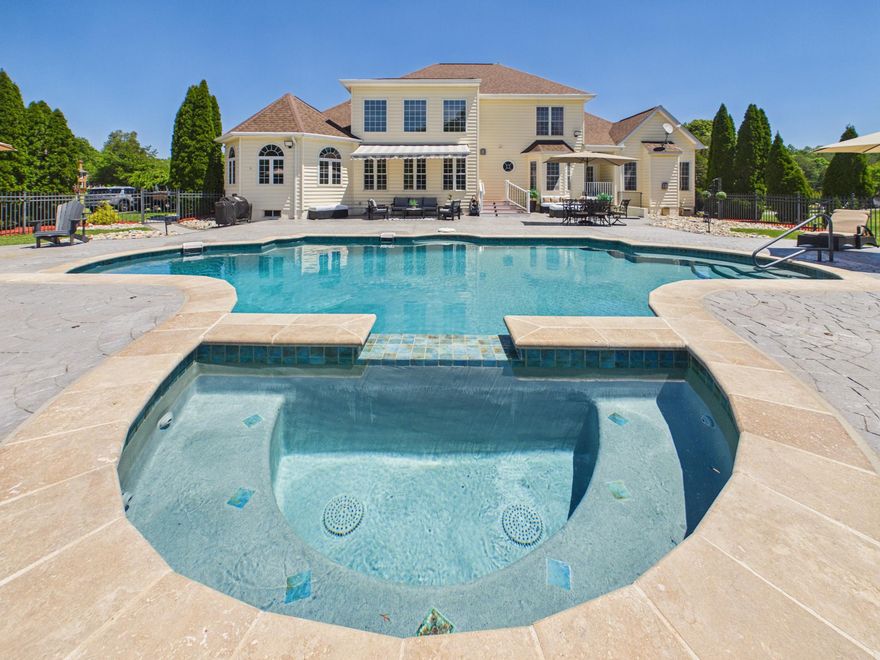 ** SELLER NOW OFFERING BUYER CREDIT TOWARDS CLOSING COSTS/RATE BUY DOWN WITH A SERIOUS ACCEPTED OFFER**
**LIST OF UPGRADES IN DOCS ($280,000 IN UPGRADES)
Set behind a private approach on 3.03 serene acres, this Northern Virginia Luxurious Estate delivers a rare combination of privacy, refined living, and resort-style outdoor design within reach of Washington, D.C.

A Rare Blend of Elegance, Privacy, and Lifestyle, Designed to Impress

The outdoor environment defines the property. A fully reconstructed saltwater pool and spa with upgraded Omni Logic automation system anchors expansive stamped concrete terraces designed for elevated entertaining. Mature landscaping, open green space, and thoughtful lighting create a true private retreat atmosphere.

Inside, the home offers main-level living convenience with a spacious primary suite and additional bedroom on the entry level. Over $275,000 in recent capital improvements provide exceptional turnkey confidence, including three newly installed HVAC systems, renovated bathrooms, upgraded lighting and fixtures, refreshed hardwood flooring, and a fully finished lower level featuring a private cinema and dedicated fitness suite.

Every detail reflects careful investment in both lifestyle and infrastructure, delivering immediate enjoyment without deferred maintenance concerns.
Strategically positioned along Virginia’s Washington–Richmond corridor and near major federal and executive employment centers, the region continues to benefit from expanding commercial investment and residential growth, including large-scale entertainment and hospitality developments such as the upcoming Kalahari Resorts & Conventions and new mixed-use initiatives throughout the I-95 corridor. Continued data and technology sector expansion in Northern Virginia,  including operations by Amazon Web Services, further reinforces long-term regional strength. 
For buyers seeking privacy, turnkey condition, and estate-level outdoor amenities in Northern Virginia, this property offers a compelling alternative to higher-priced luxury submarkets while remaining connected to one of the East Coast’s most dynamic growth corridors.

Private showings available by appointment. Executive relocation and international buyers welcomed. Furnished estate option available.