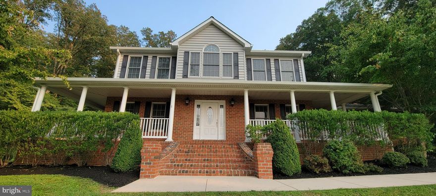 Ever wish you had a front porch you could sit on and let your worries slip away??  Well, check out the brick wrap around porch on this baby!  
Don't miss out on this stunning Custom built home in Glen Arm.  This is a beautiful 4 bedroom, 2.5 bathroom colonial situated on 2 acres that is spacious and has so much to offer.  Some of the amenities include a gourmet kitchen with white cabinets,  Corian counters, a large island with seating, stainless steel appliances and rooms for an additional dining table.  The family room adjoins the kitchen.  Perfect for family time and entertaining!  The oversized family room has a gorgeous stone gas fireplace.  On the main floor of the home you also have a dining room and another large room perfect for almost anything you need it for.  The mudroom off the 3 car garage is also where you will find the laundry room. Here you will also find a huge room perfect for an additional pantry or storage room.
Upstairs there are four generously sized bedrooms including the master suite with vaulted ceilings, a sitting area, walk in closets and a spa-like luxury bathroom with a double vanity, a corner soaking tub and separate shower with a glass surround.  Sound amazing??  It is!! 
The lower level is unfinished, but is amazingly large with over 1,600 sq ft additional space with high ceilings.   You can access the basement from inside the home or by the staircase outside.
Entertaining made easy with the large back patio off the kitchen and access to the wrap around porch from the family room.
This place is truly a one of a kind.  Be sure to check it out!