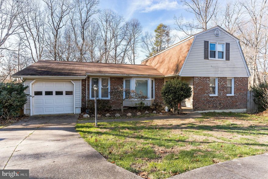 Plenty of room to grow in this 4 bedroom 3bathroom single family home located at the end of a cul-de-sac. Walk into a light and bright family room with wood floors and large bay window that easily moves into the kitchen with granite counter tops, plenty of storage and stainless steel French Door Refrigerator. 2 bedrooms and 2 bathrooms complete the level for easy living. One bedroom includes en-suite with stall shower. The upper level includes 2 bedrooms and a hall bathroom. The walk out lower level with wood stove is perfect for additional living space. Enjoy time outside on the deck or patio overlooking the spacious fenced in back yard backing to a line of trees. Heat pump updated 2020. Easy access to multiple commuter lots, 95, Potomac Mills, Shopping and Dining.