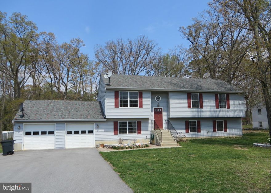 Looking for a nice big home on a nice big lot at a great price, with no HOA? Nearly 2500 finished sf includes living/kitchen/dining plus 3 BRs, 2 baths on main level; family rm, 4th BR, 3rd full bath, office/5th BR, laundry on lower level. Built in 2007, home has laminate floors, tile backsplash in kitchen, front-loading washer/dryer. Oversize 2-car gar, deck; playground equipment & shed convey!